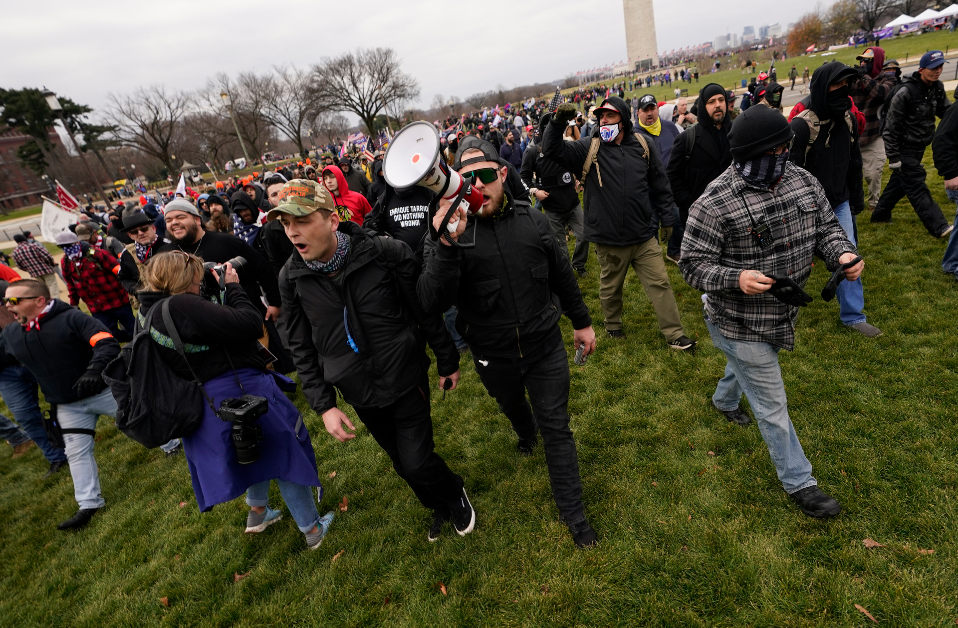 Ethan Nordean, with backward baseball hat and bullhorn, leads members of the far-right group Proud Boys in marching before the riot on January 6. Photo / Carolyn Kaster, AP, File