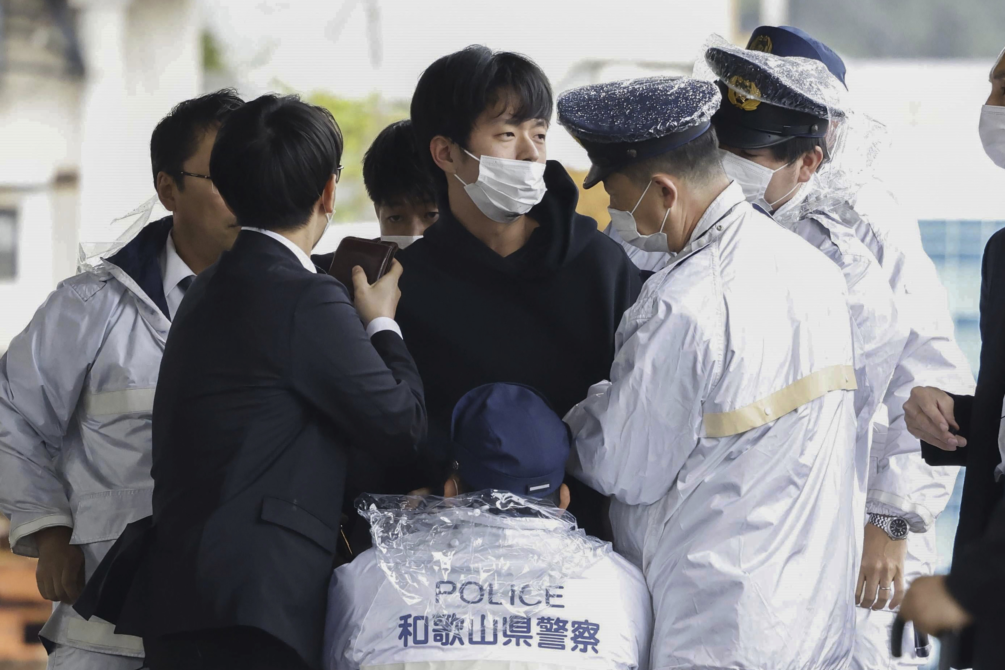 A man who was later identified as Ryuji Kimura is arrested after what appeared to be a pipe bomb was thrown at Japanese Prime Minister Fumio Kishida. Photo / AP