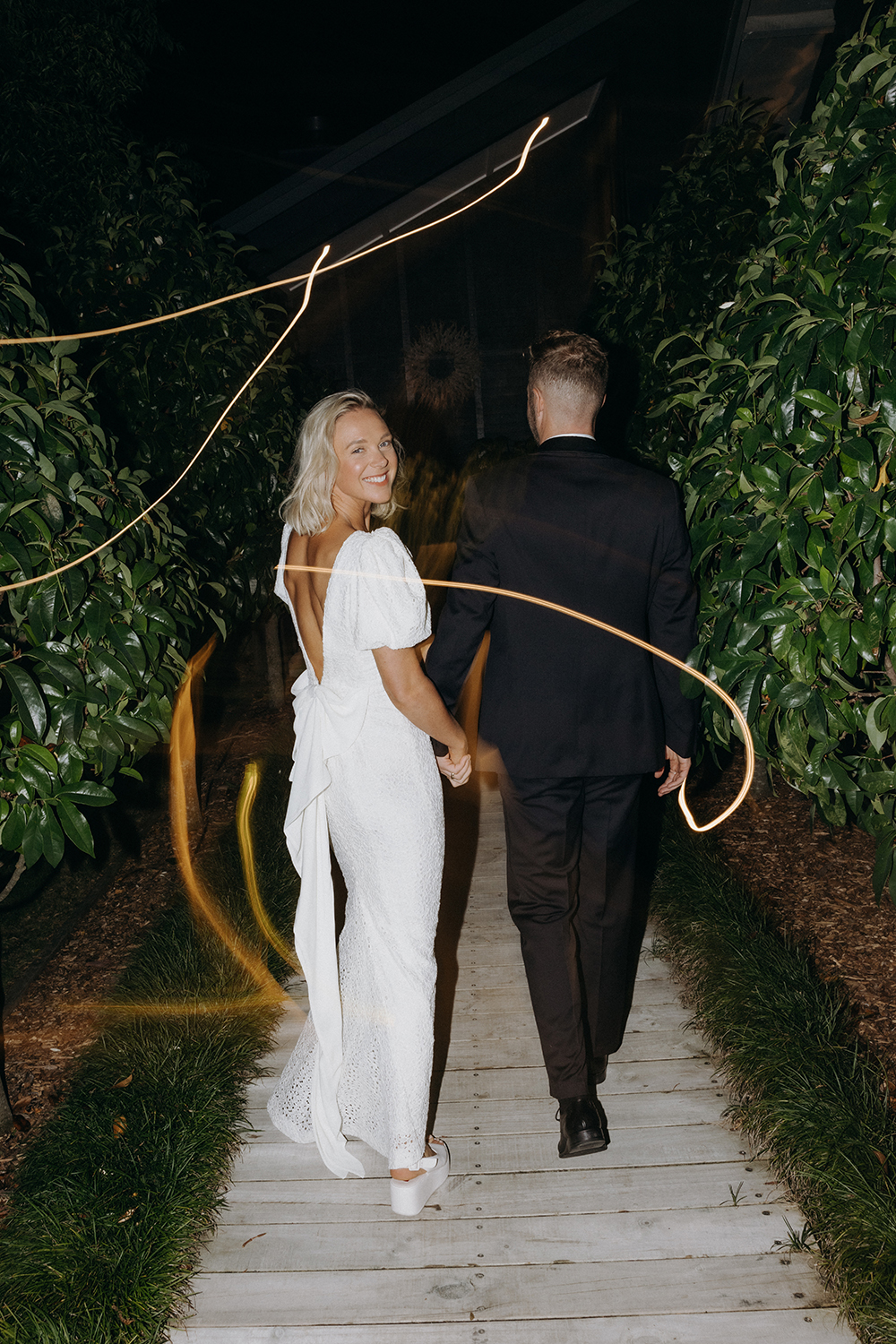 Natalie changed into a vintage gown from Love James for the reception. Photo / Ana Galloway