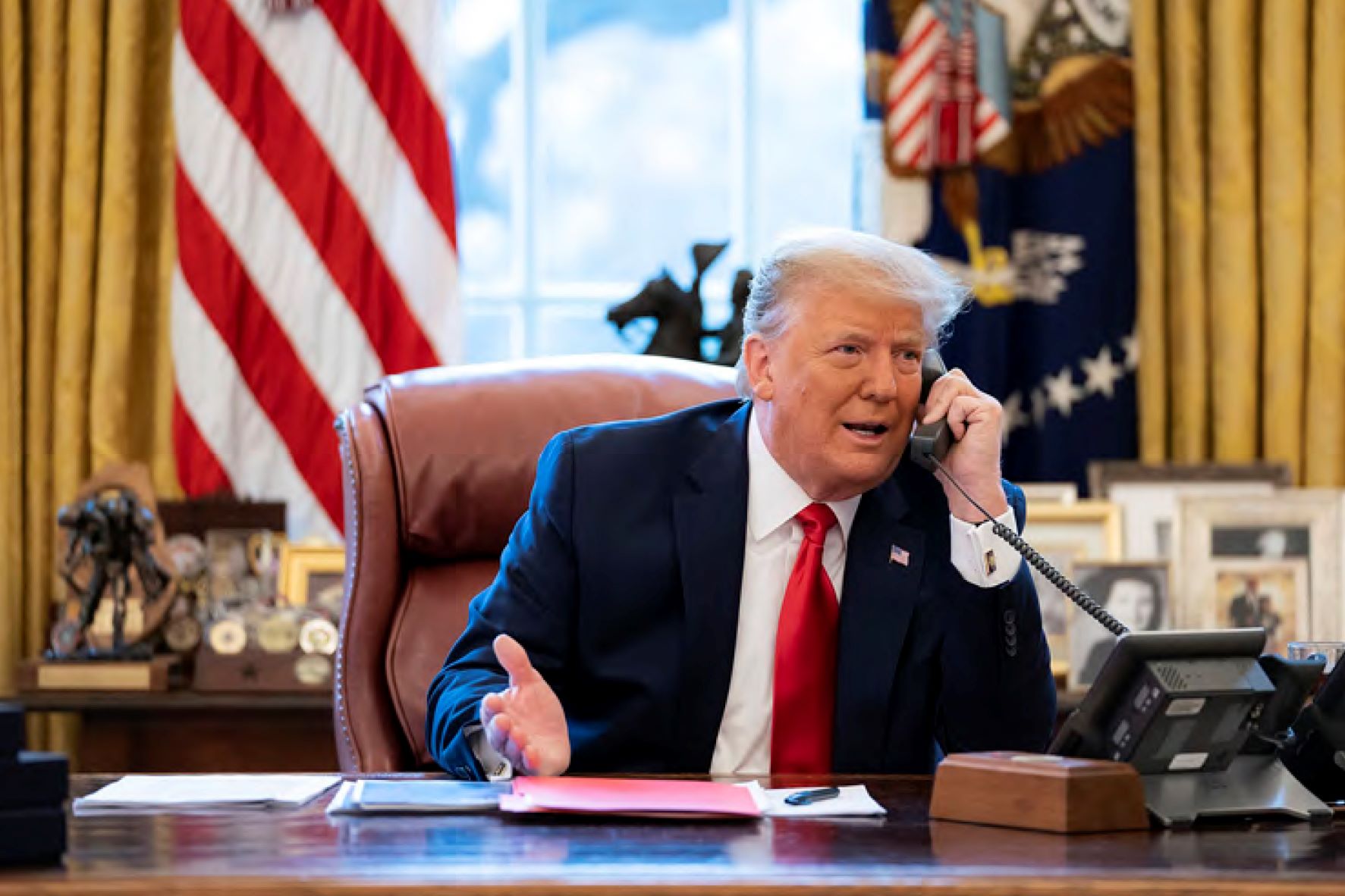 In this image released in the final report by the US House of Representatives' select committee investigating the January 6 attack on the US Capitol, President Donald Trump talks on the phone to Vice President Mike Pence from the Oval Office of the White House on the morning of January 6. Photo / via AP