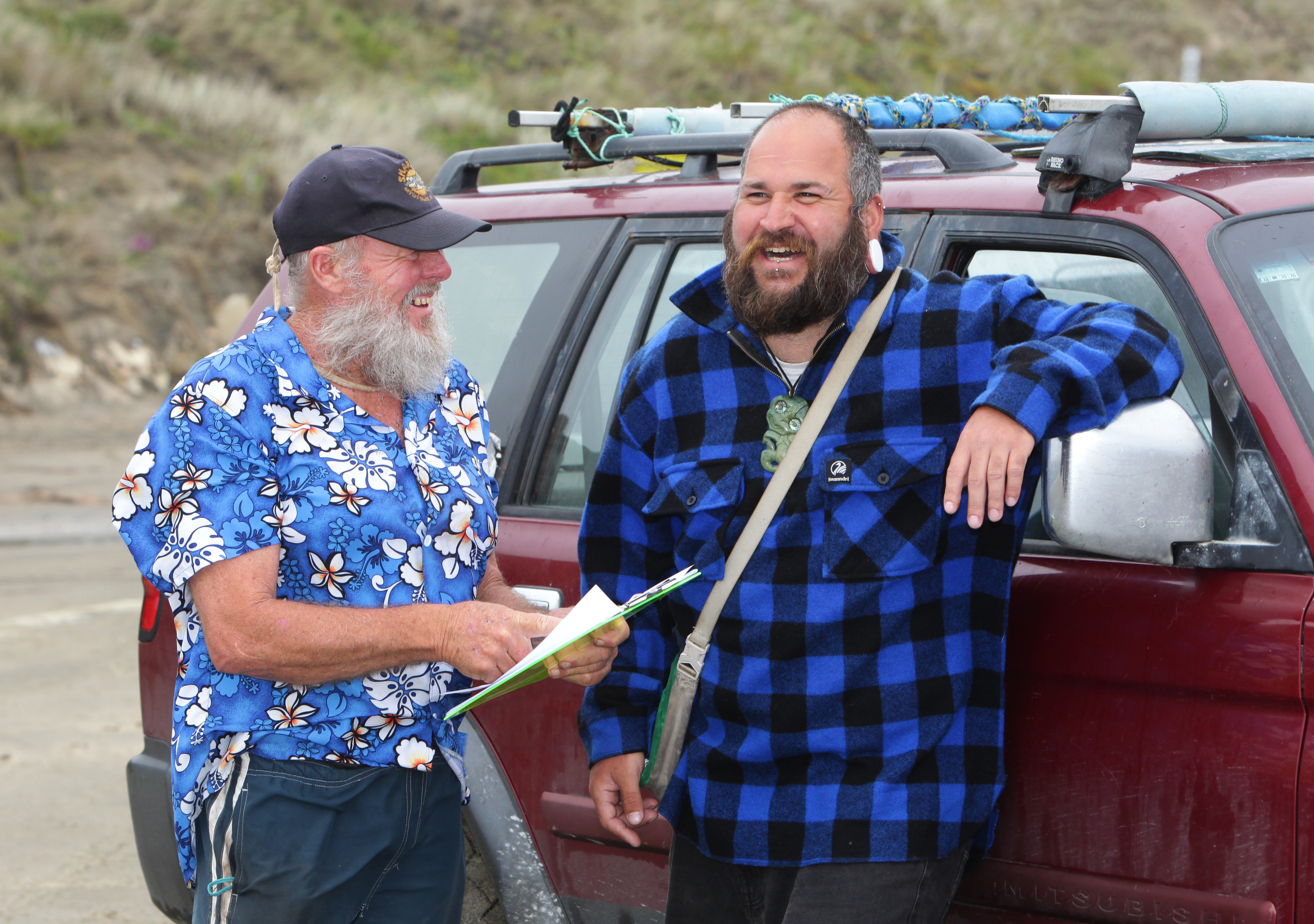 Local residents Con Fowler and Blair Preston discuss the day's happenings on Ripiro Beach