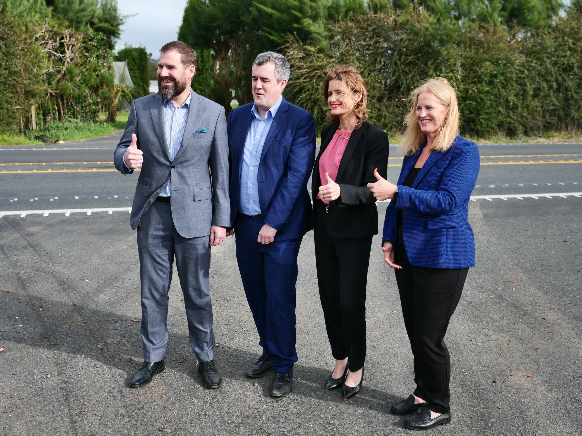 Waikato MP Tim van de Molen (from left), Transport Minister Chris Bishop, Finance Minister Nicola Willis and Taupō MP Louise Upston at the Cambridge to Piarere Road of National Significance site near Karāpiro on Sunday. Photo / Tom Eley