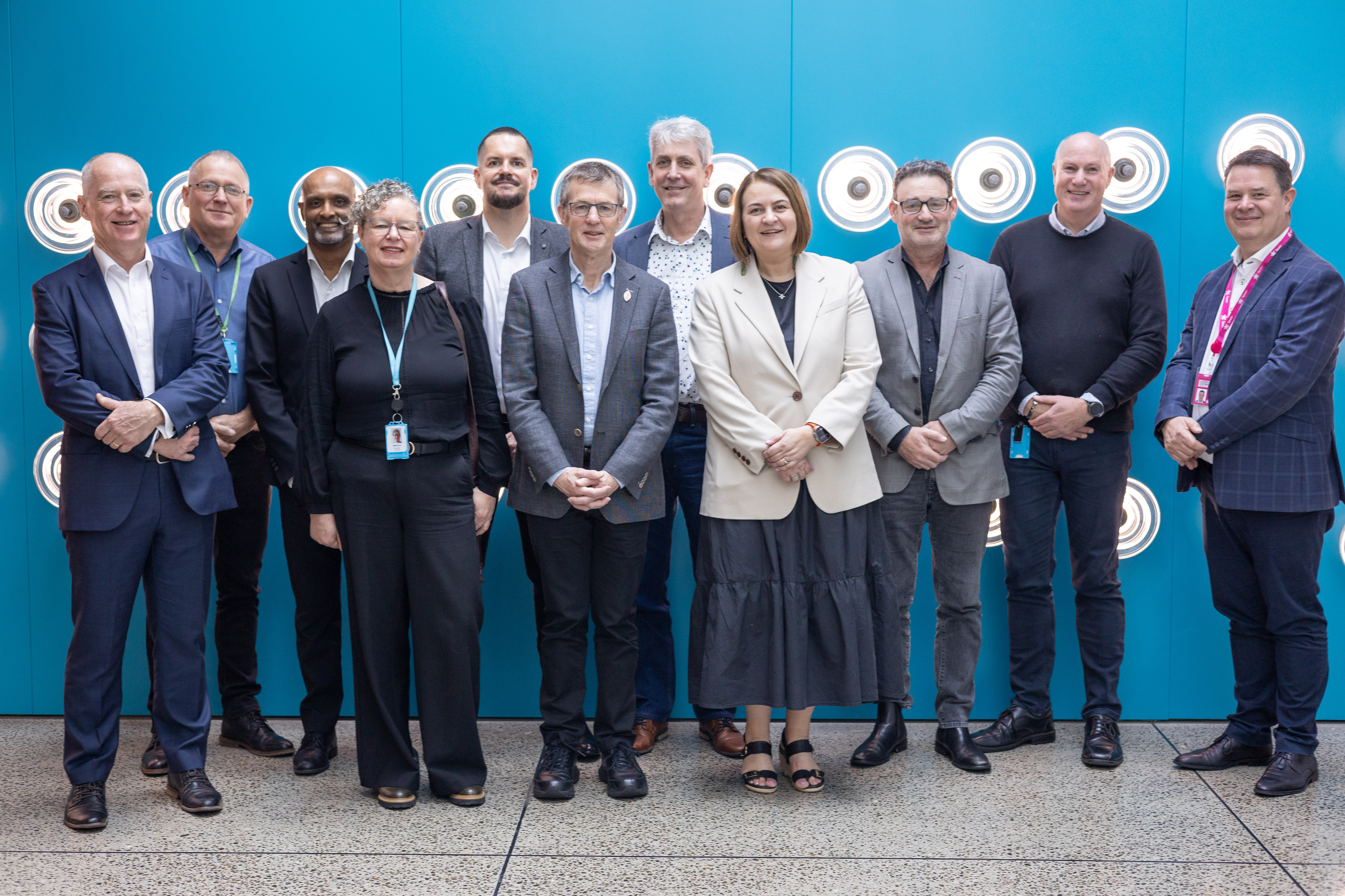 Transpower and Spark executives including Spark CEO Jolie Hodson (fourth from left), Transpower CEO John Clarke (sixth from left), Spark enterprise and government director Mark Beder (to Hodson's right) and Transpower information services GM Corbus Nel (to Hodson's left).