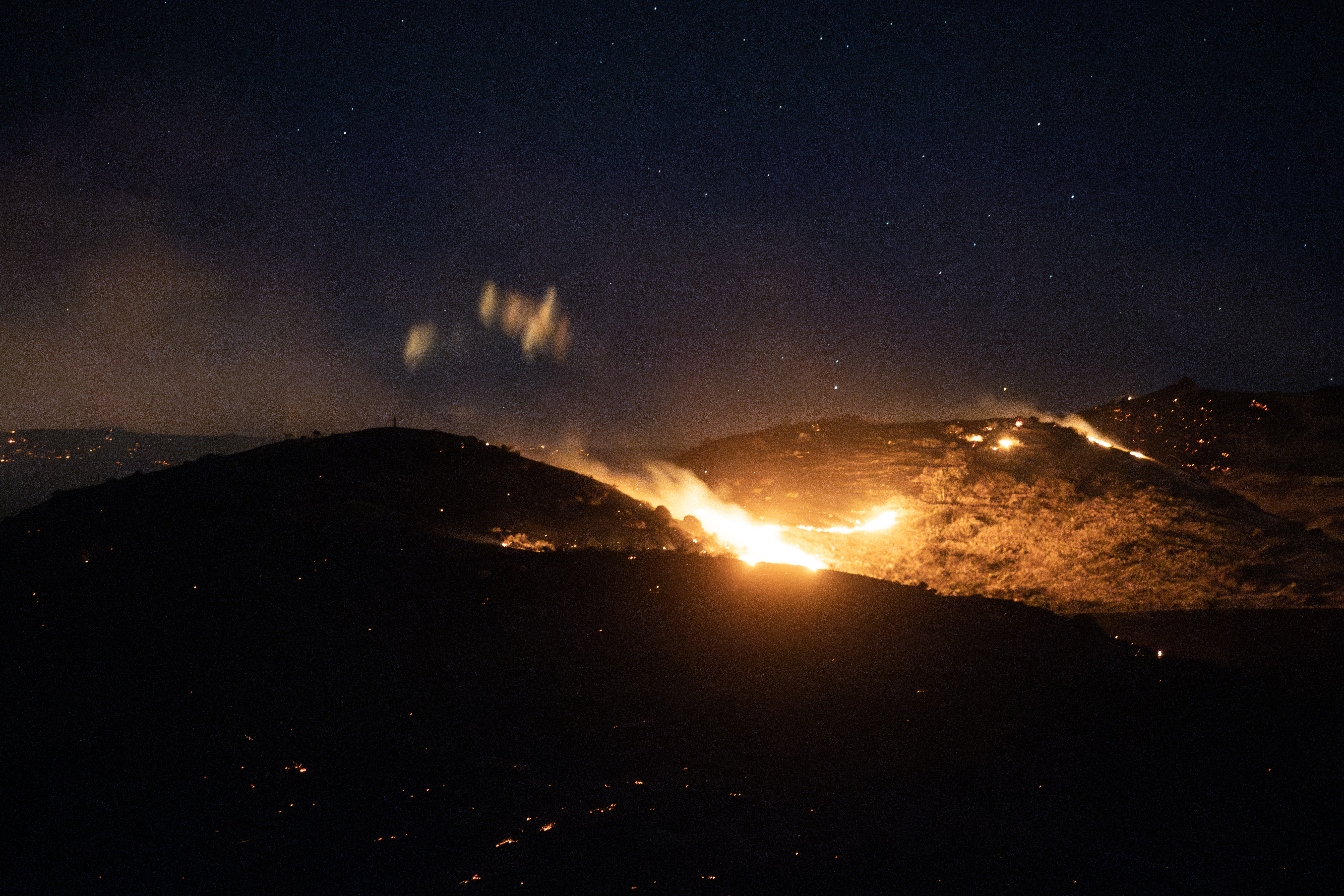 Homes were evacuated as firefighters battled a large vegetation fire near Waipara on Sunday. Photo / George Heard
