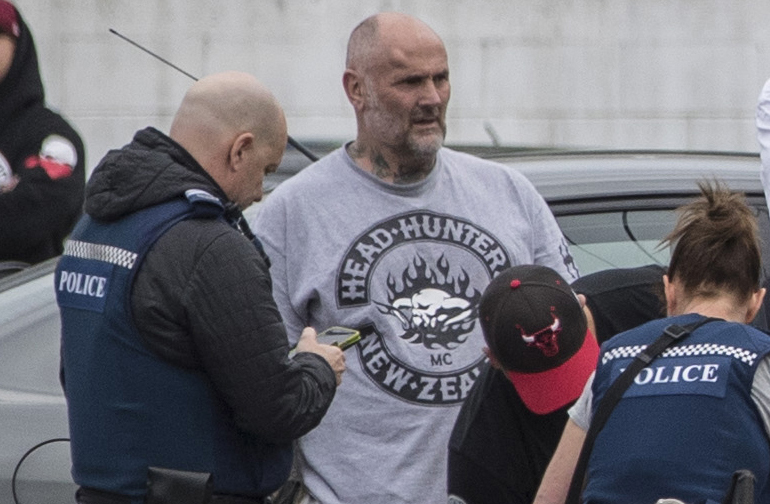 Head Hunter president Wayne Doyle speaks to police as $6m of property restrained in September. Photo / NZ Herald