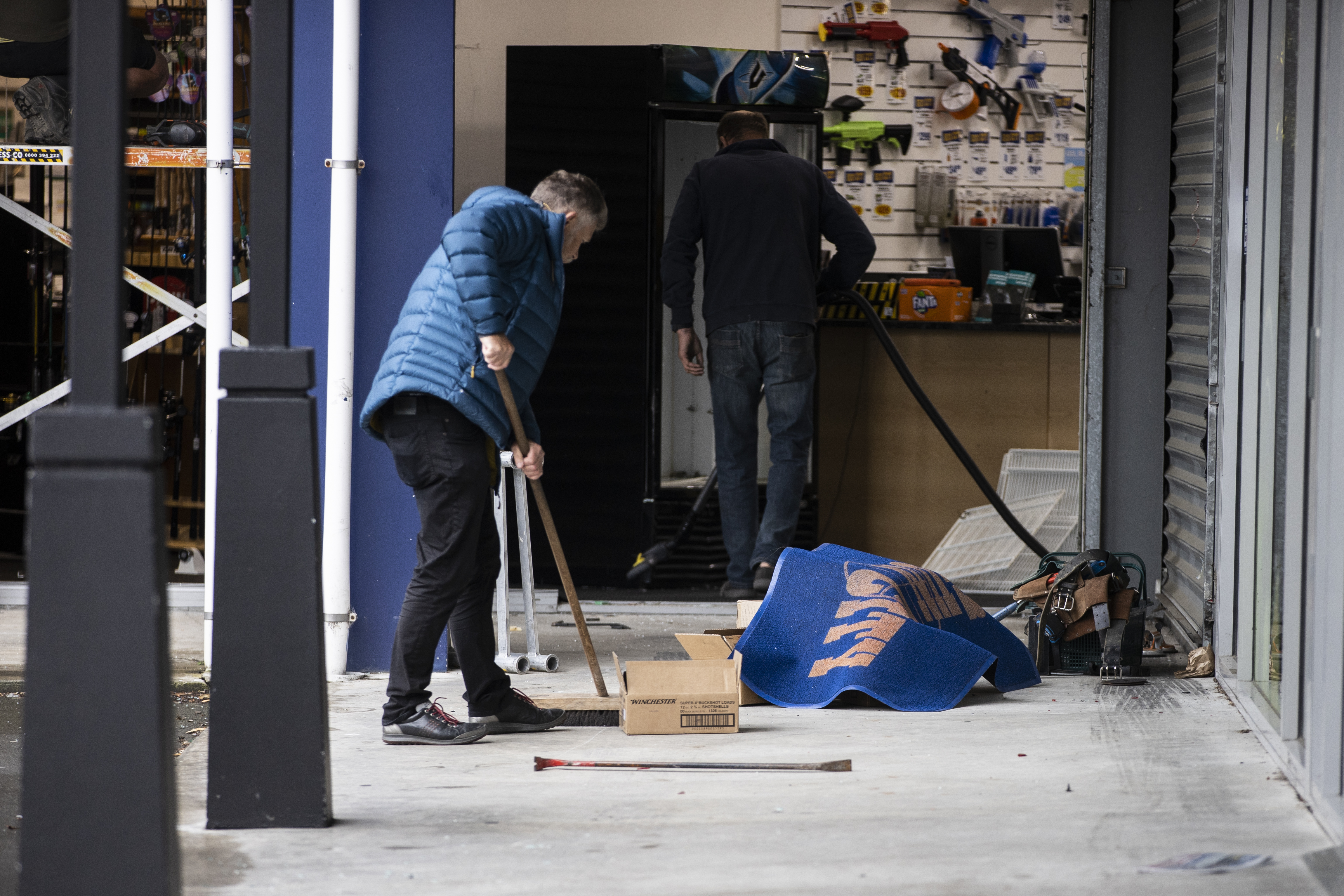 The clean-up at Gun City in Christchurch after it was ram raided overnight. Photo / George Heard