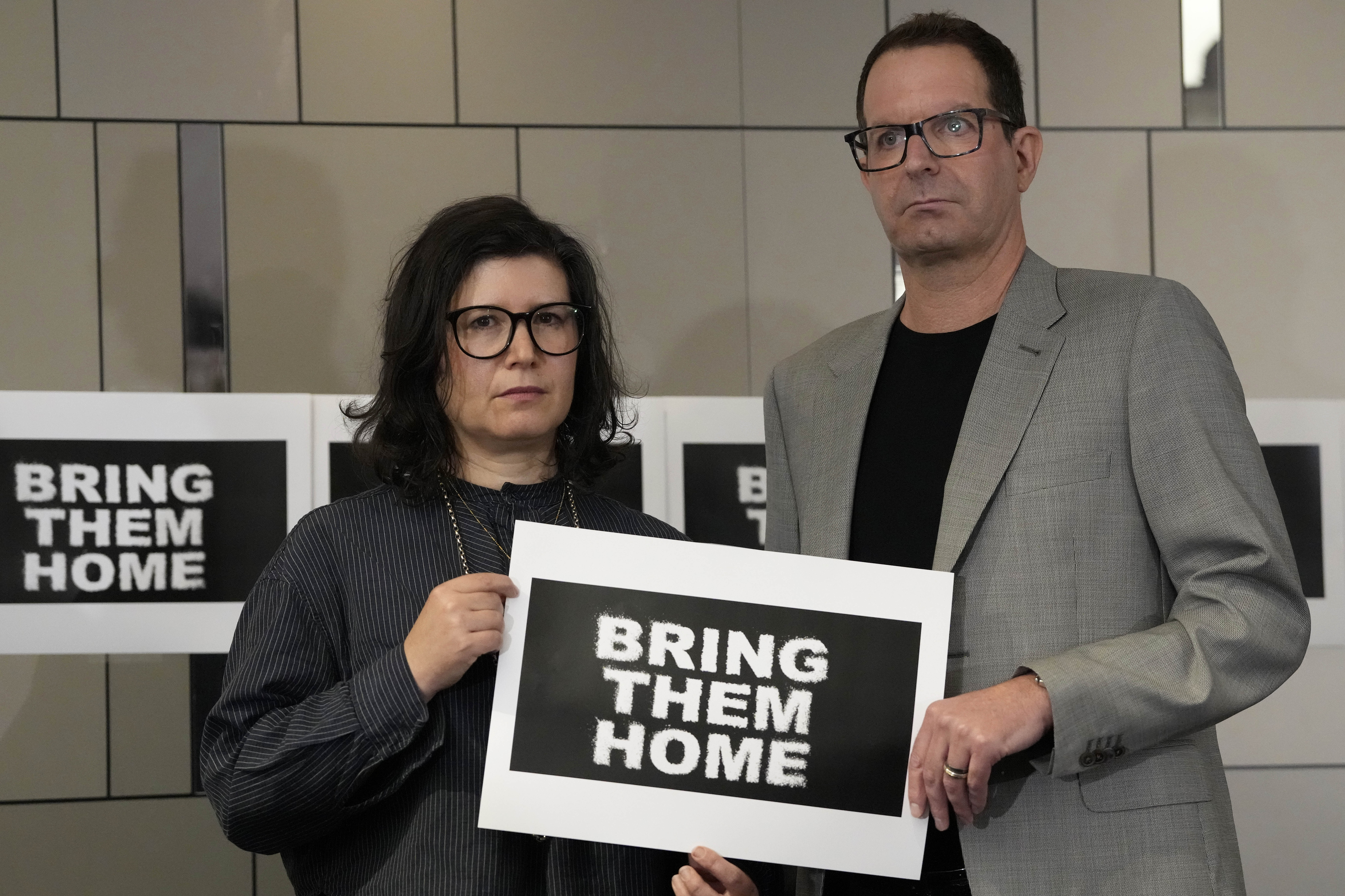 Sharon Lifschitz (left) and Noam Sagi pose for photographers after a press conference of British children of Israeli hostages at a hotel in London on Thursday, October 12, 2023. Noam Sagi, 53, is a London-based psychotherapist who grew up on Kibbutz Nir Oz. His 75-year-old mother, Ada Sagi, was taken hostage on October 7. Sharon Lifschitz, 52, is an artist and academic whose parents are peace activists aged 85 and 83 and who were taken hostage too. Photo / AP / Kirsty Wigglesworth