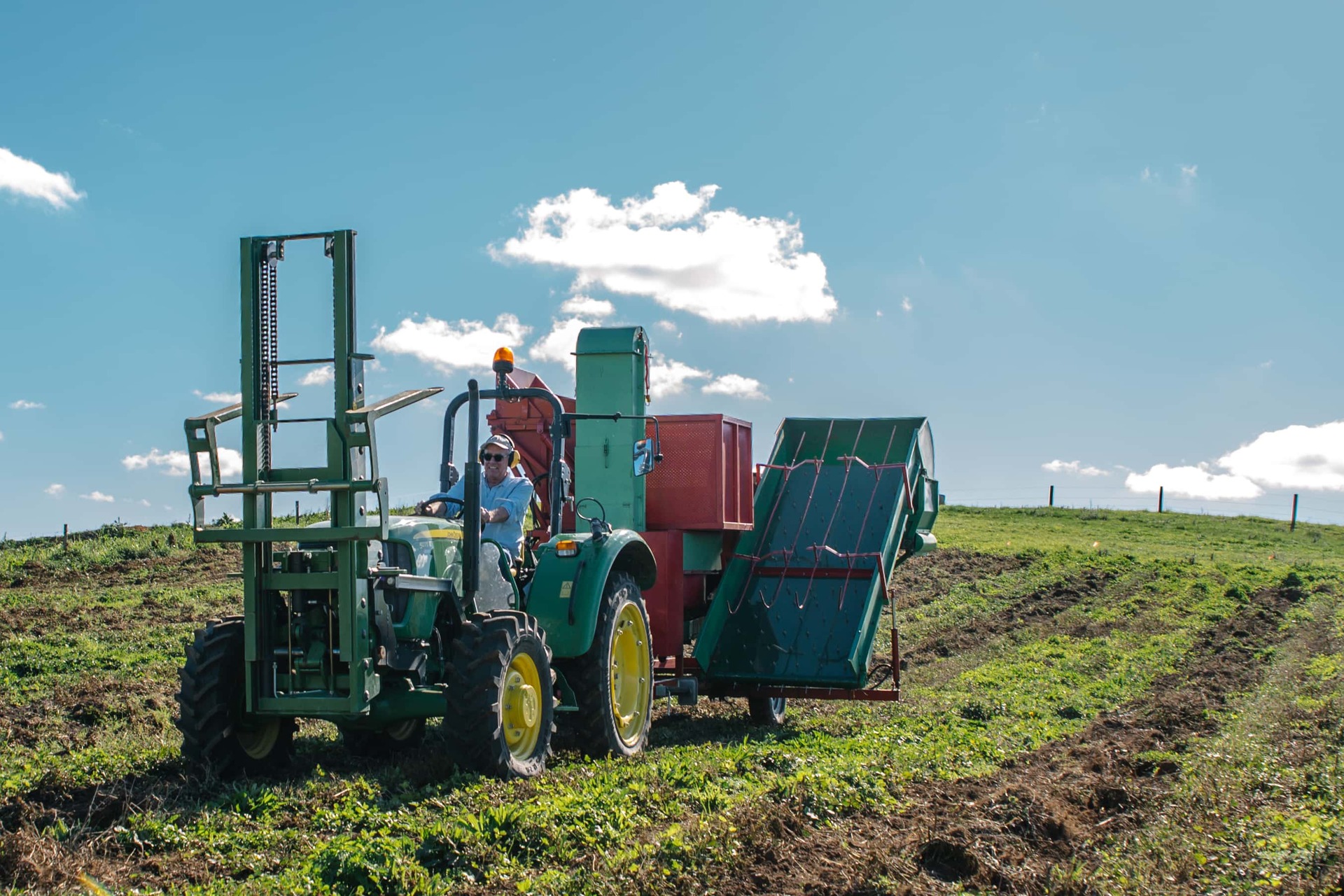 Pic's Peanut Butter founder Pic Picot working the machinery on a trial Northland peanut farm. Photo / Supplied