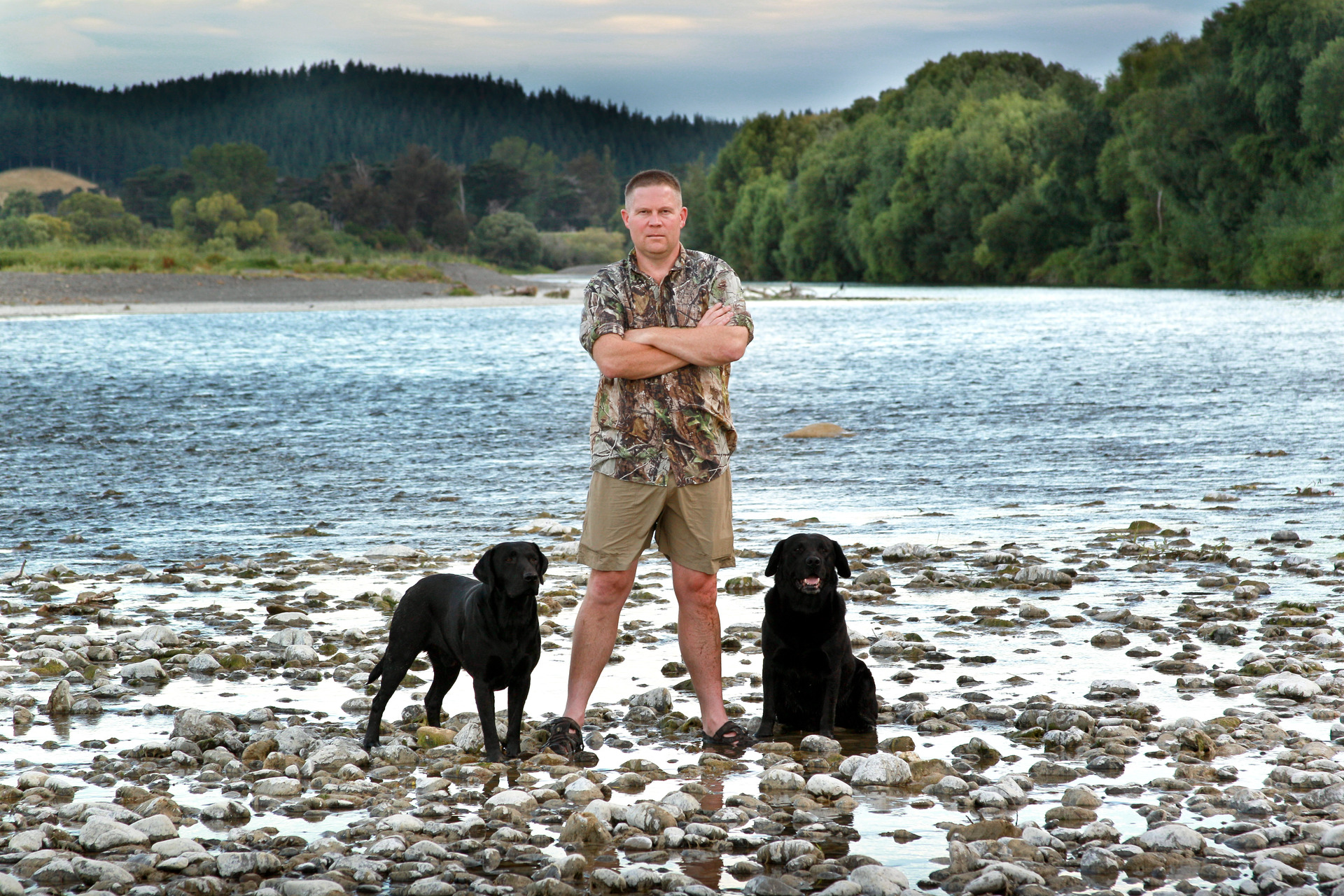 Political campaigner Simon Lusk of Havelock North with his dogs Bruce and Mabo on the Tukituki River, Havelock North. Photo / Warren Buckland