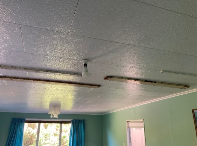The ceiling panels in one bedroom were being held up with wood screwed on to the bottom of the panels.