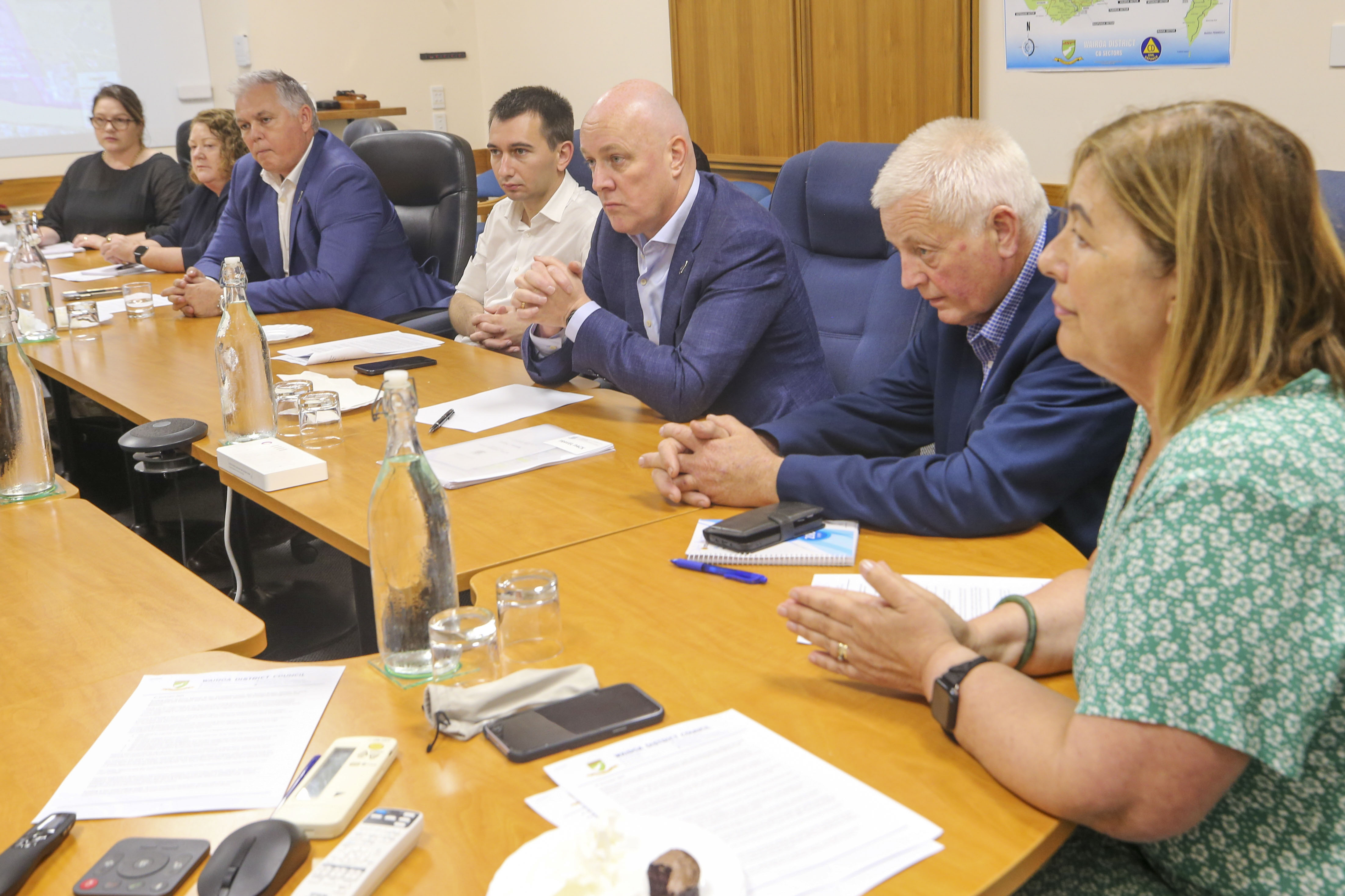 Prime Minister Christopher Luxon (centre) and Wairoa Mayor Craig Little (right), discuss the issues facing the region at Wairoa District Council. Photo / Paul Taylor