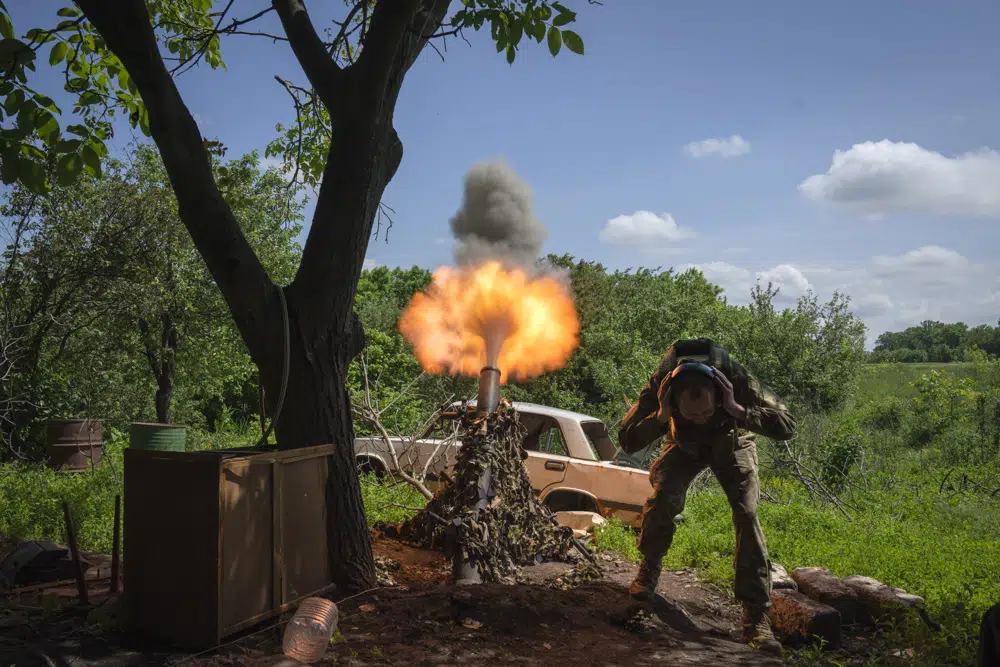 A Ukrainian soldier fires a mortar at Russian positions on the frontline near Bakhmut, Donetsk region, Ukraine. Photo / AP