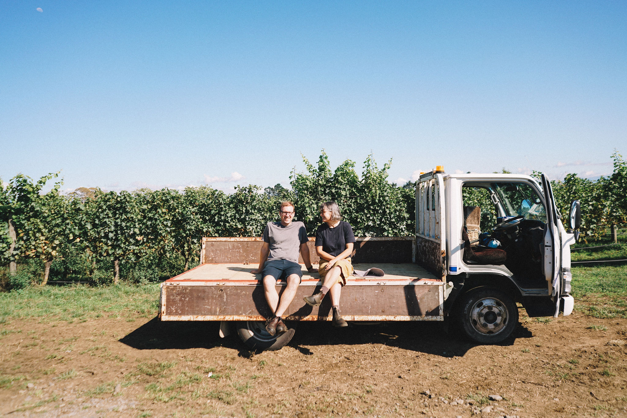 Halcyon Days’ Olly and Amy Hopkinson-Styles atop their harvest truck in the Osawa vineyard.
