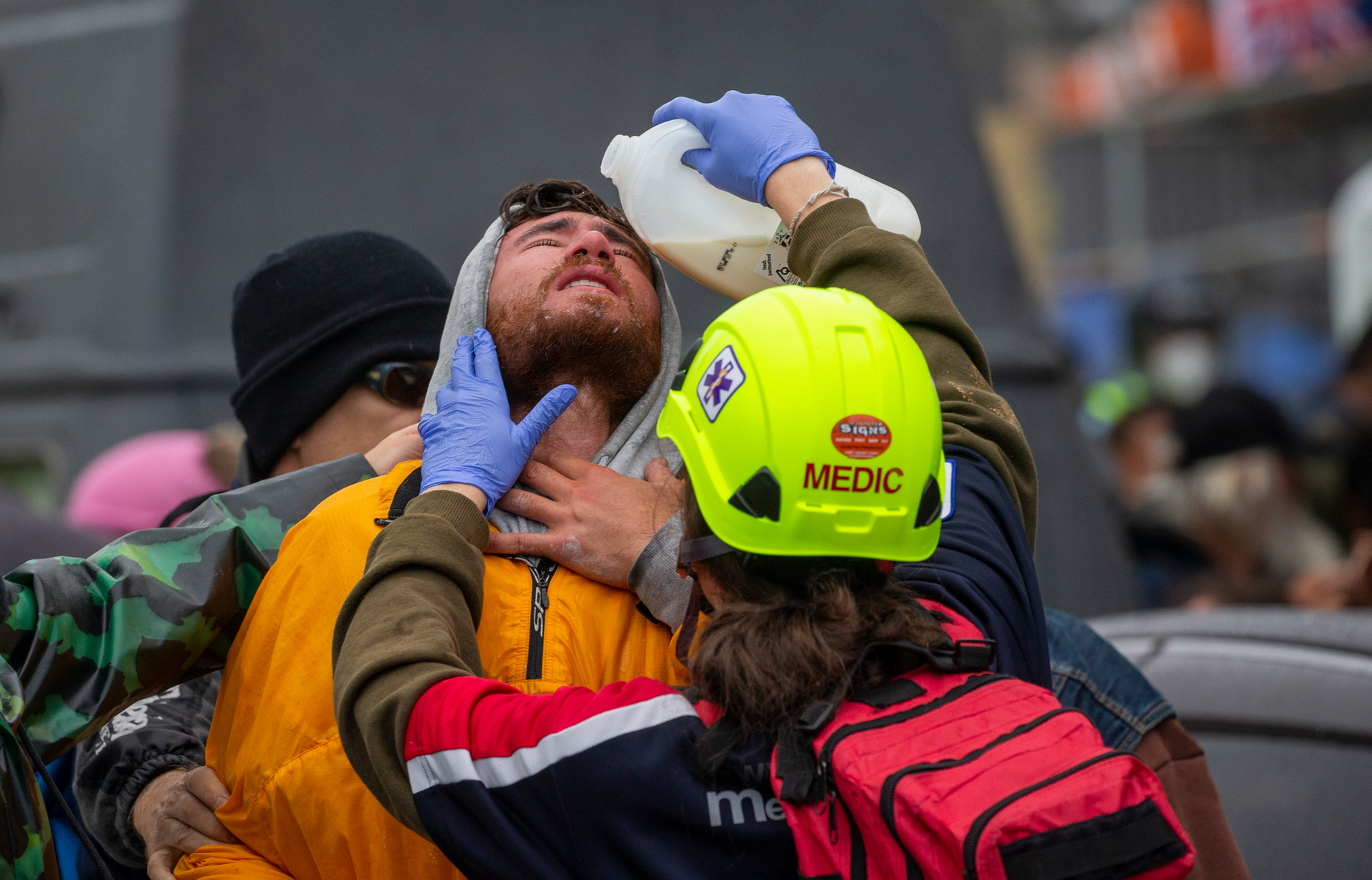A protester is treated after being pepper sprayed by Police. Photo / Mark Mitchell