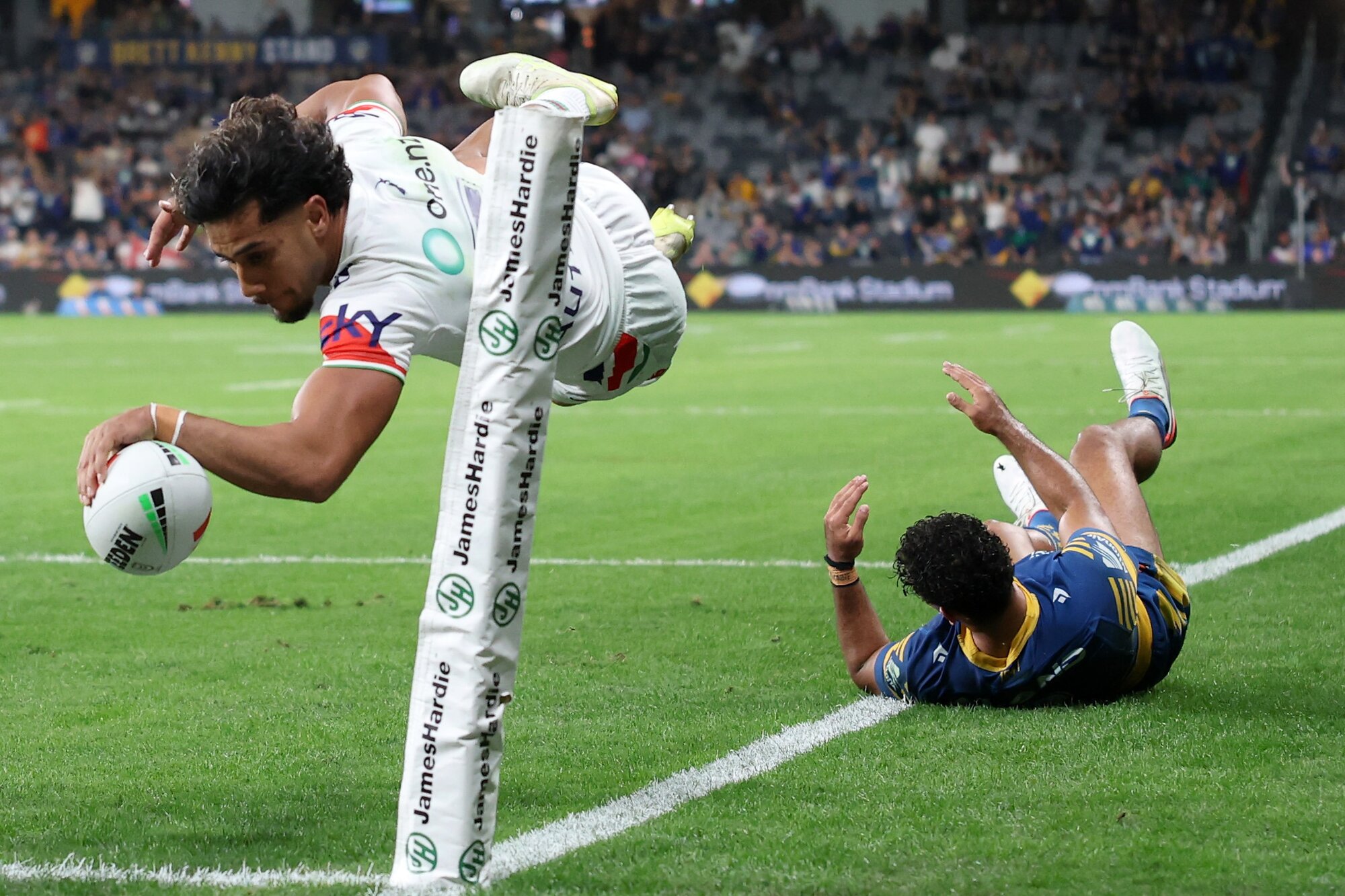 Alofiana Khan-Pereira dives to score against the Eels. Photo / Getty Images