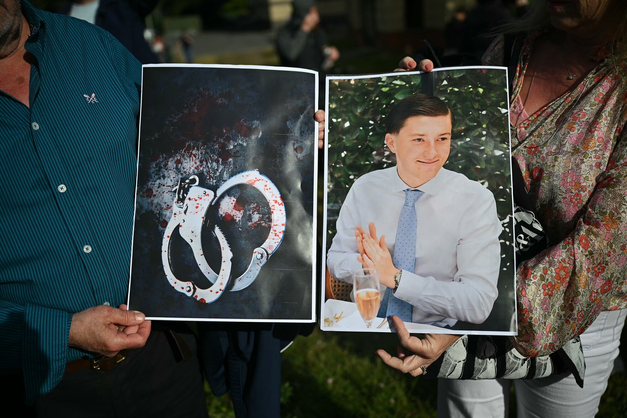 Protesters hold images of Henry Nowak outside Southampton's Central Police Station on June 2. Photo / Justin Tallis, AFP