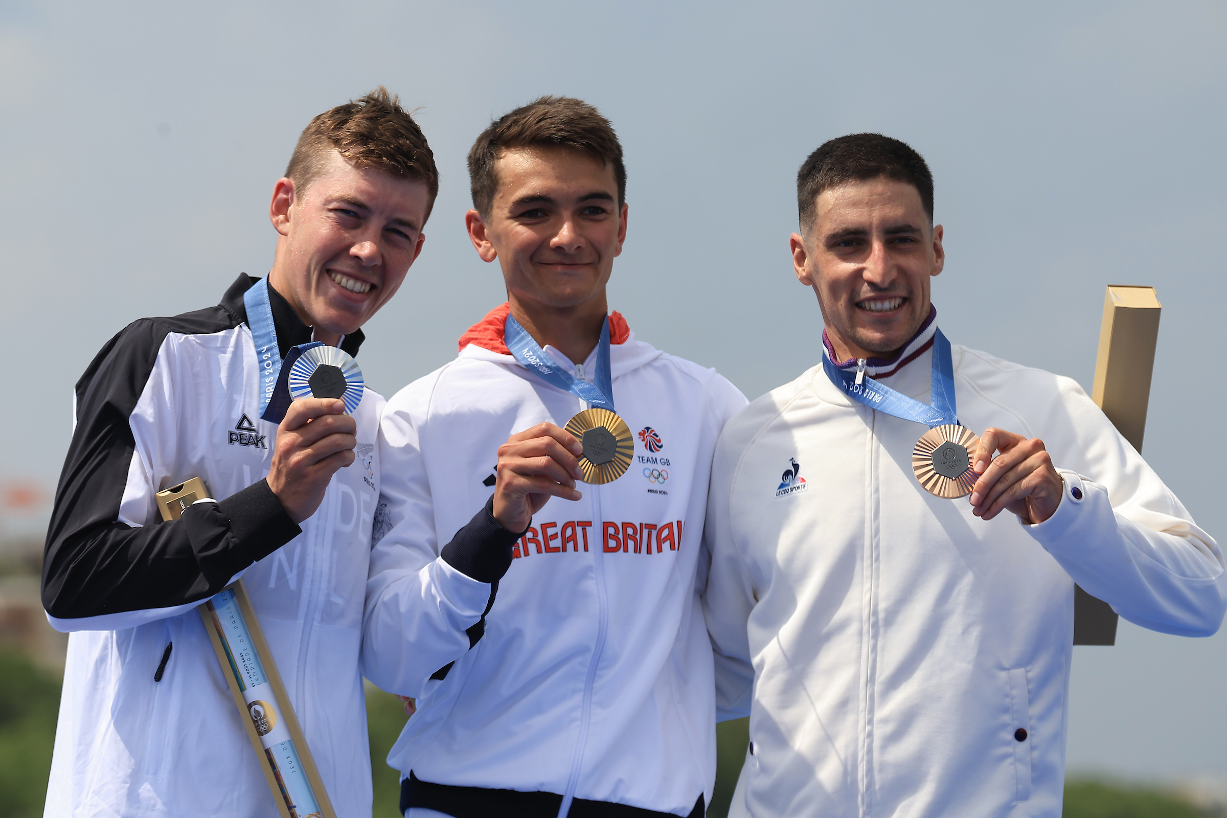 Hayden Wilde, Alex Lee and Leo Bergere on the podium after the men's triathlon at the Paris Olympics. Photo / Photosport