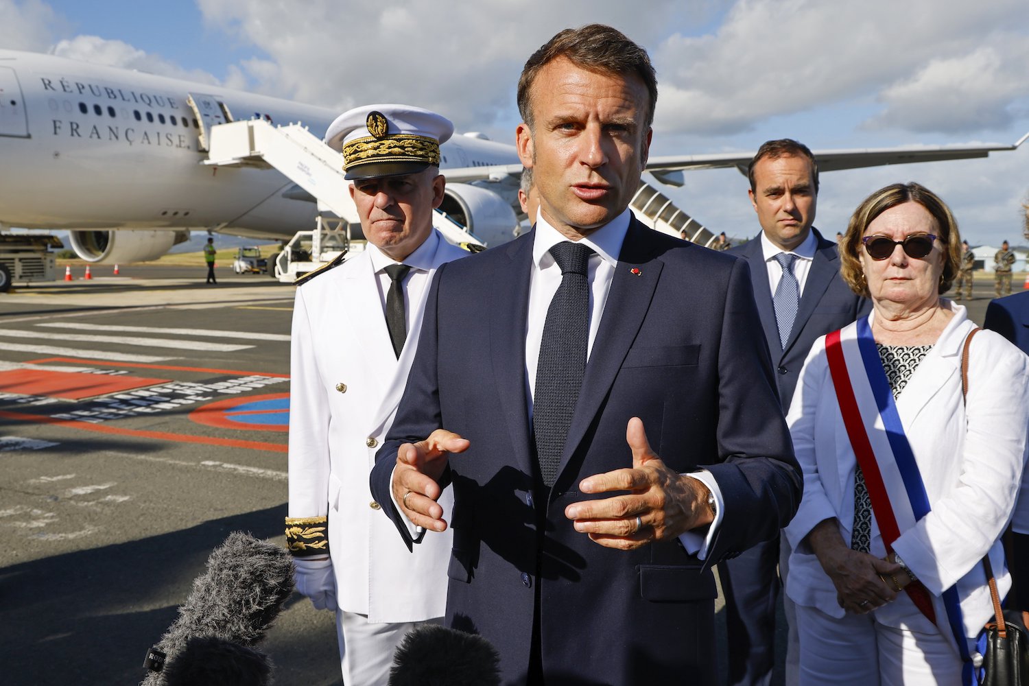 French President Emmanuel Macron speaks with the press upon arrival at Noumea. Photo / AP