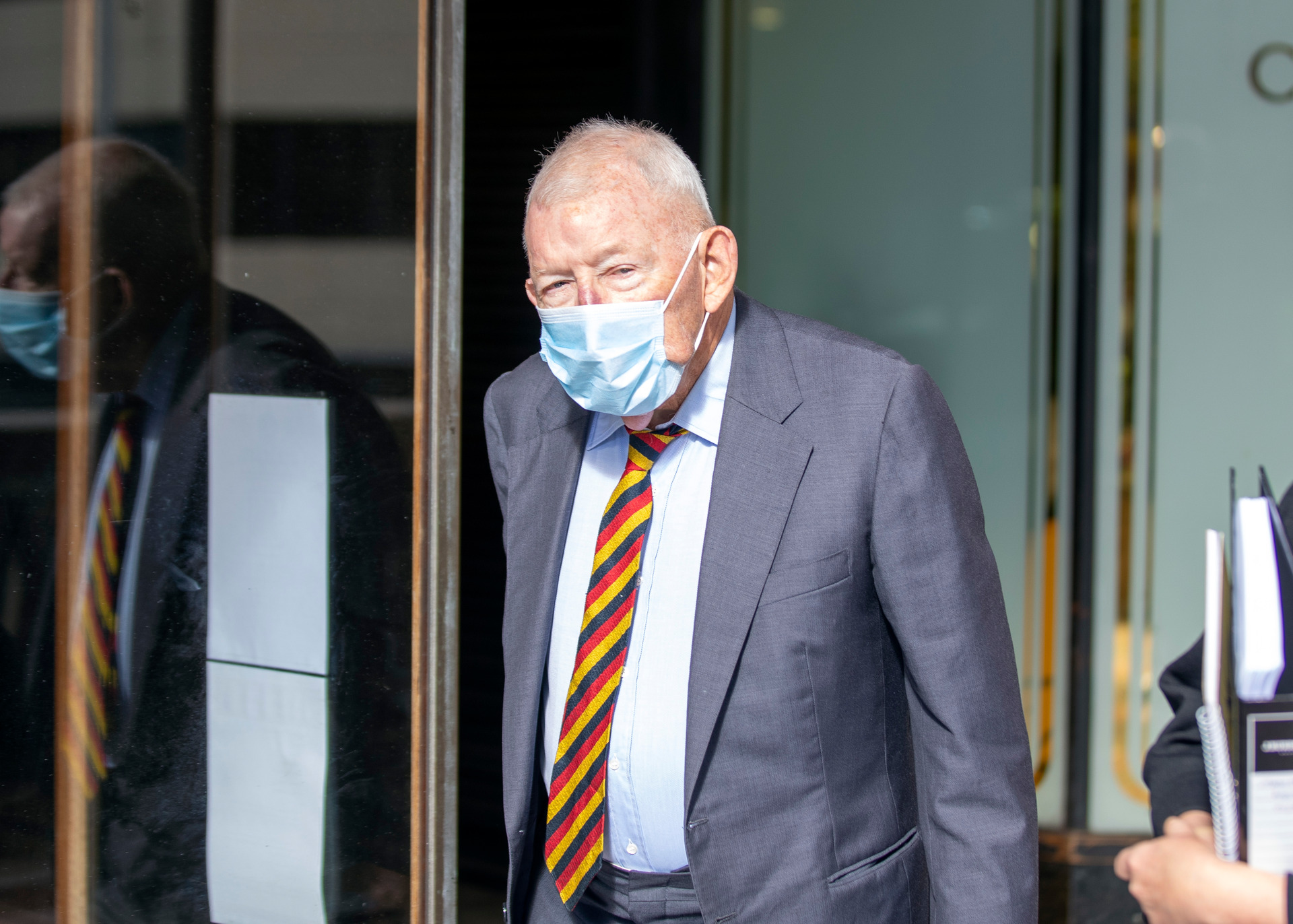 Sir Ron Brierley leaving a Sydney court after admitting possession of child sex abuse materials. Photo / Liam Mendes