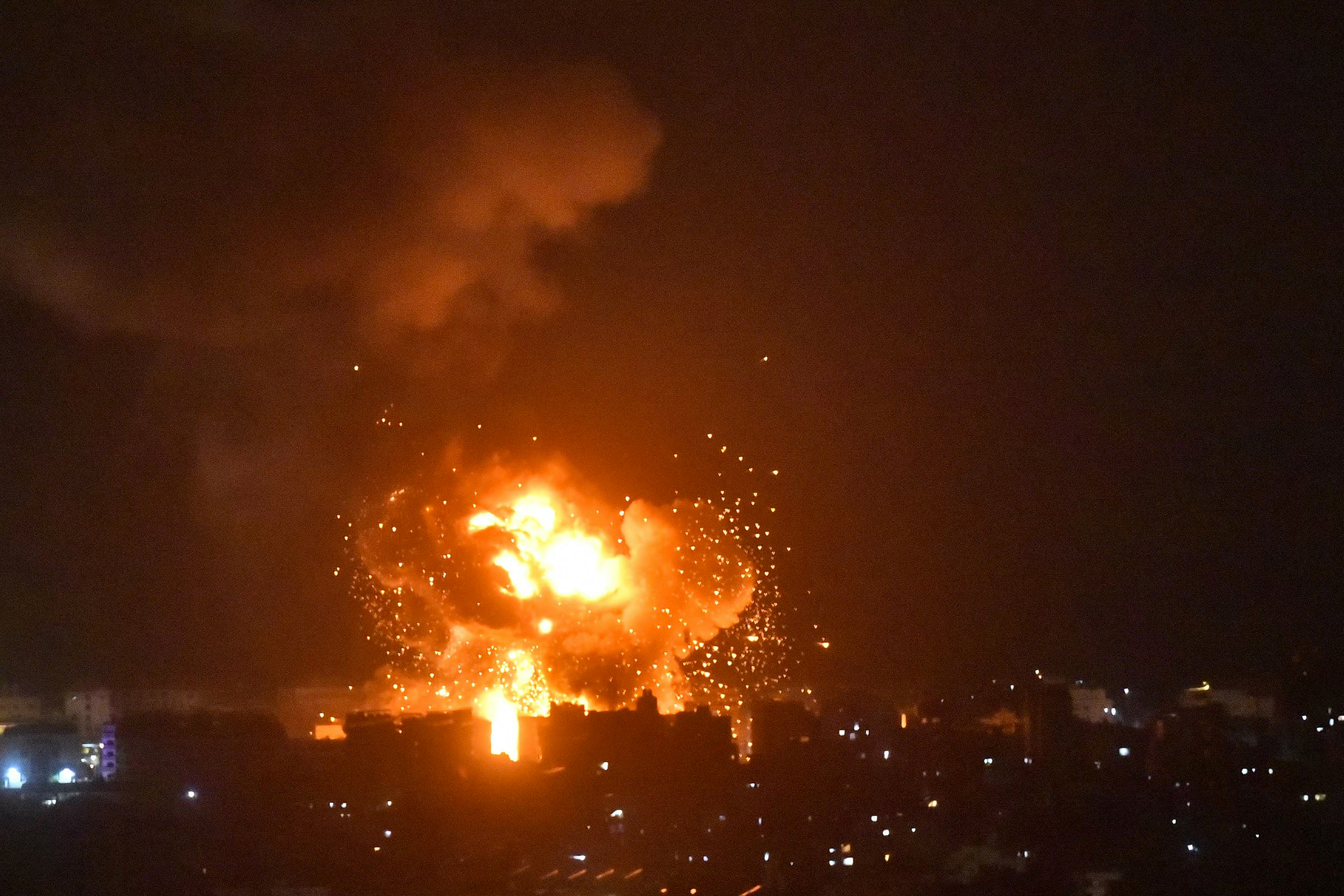 Flames and smoke rise from an area targeted by an Israeli airstrike on Beirut's southern suburbs on October 6, 2024. Official Lebanese media said five Israeli strikes hit southern Beirut and its outskirts during the night of October 5, 2024, four of them