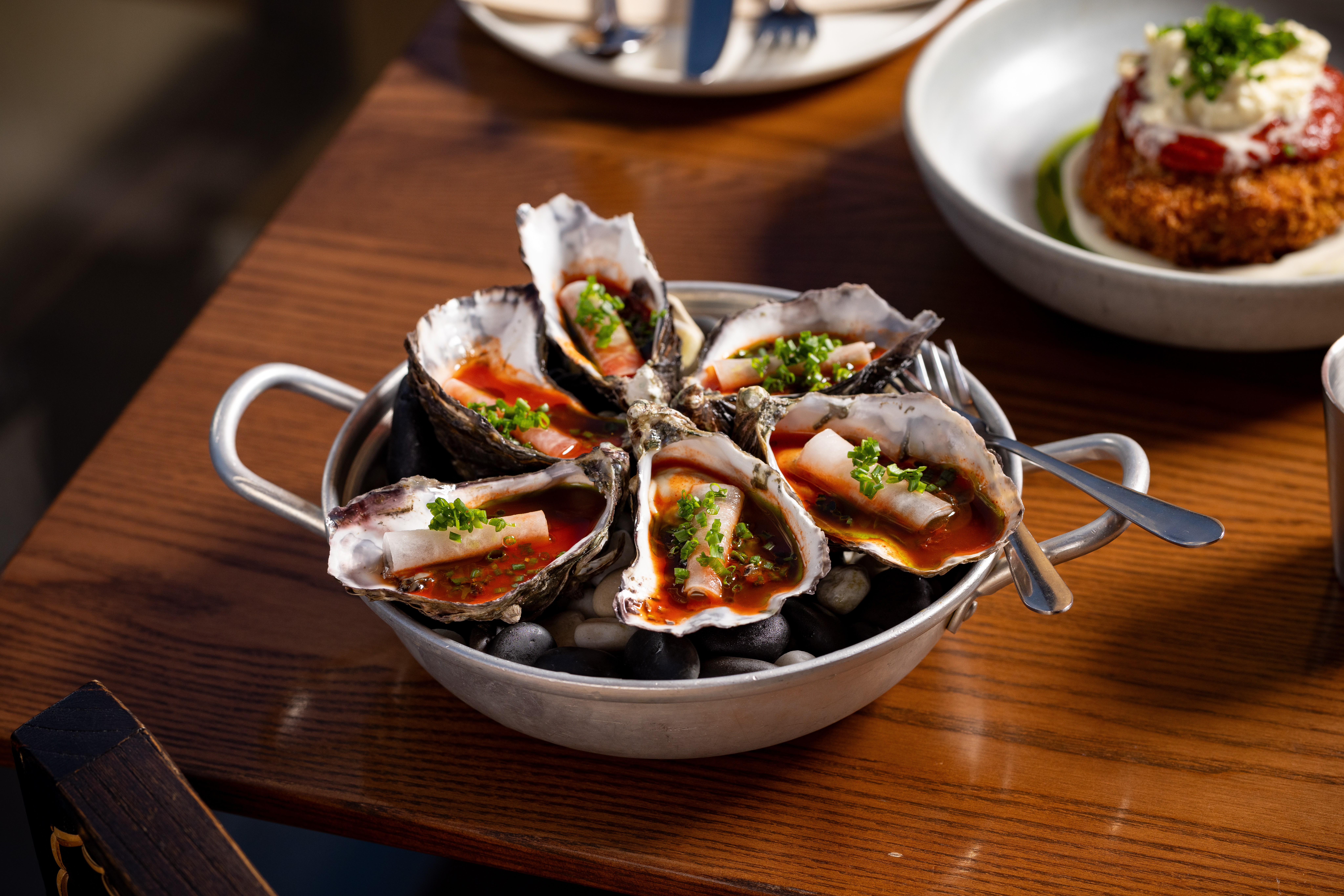 The oysters feature kimchi juice for a spicy, briny flavour. Photo / Babiche Martens