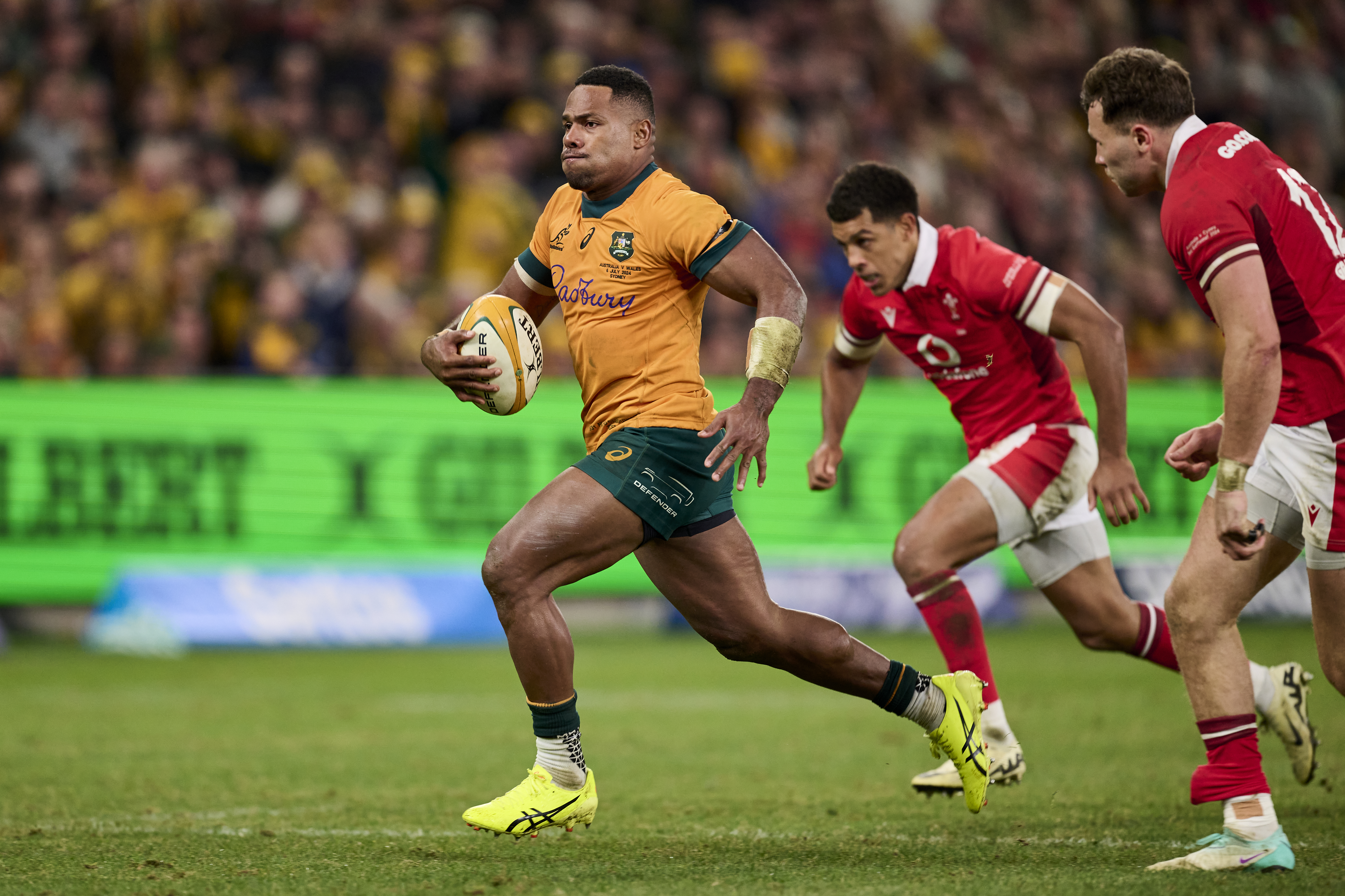 Filipo Daugunu of the Wallabies makes a break to score a try against Wales. Photo / Getty Images