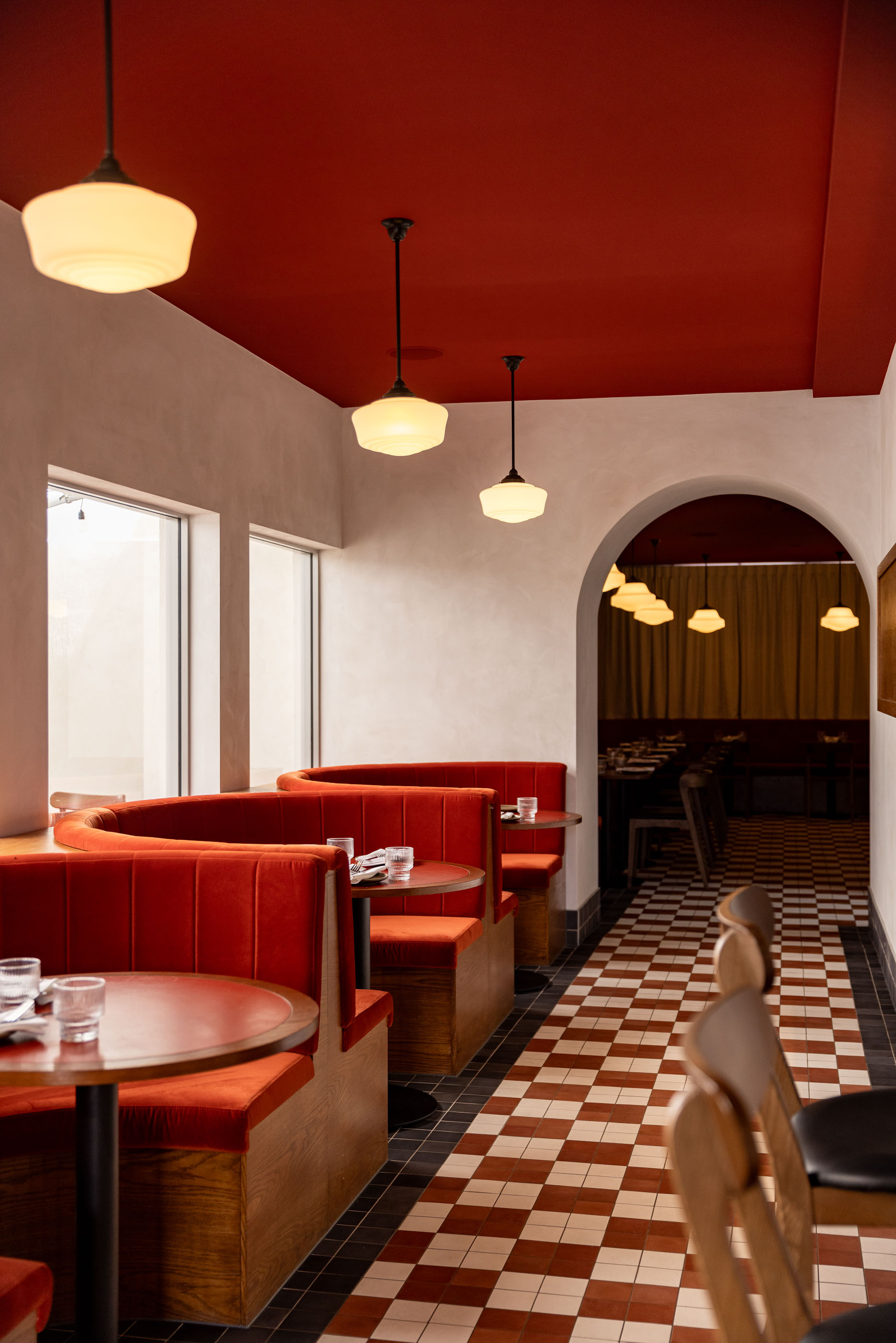 The striking chequered floor and rust-coloured booths at Korean-Spanish restaurant Bonita in Ellerslie. Photo / Babiche Martens