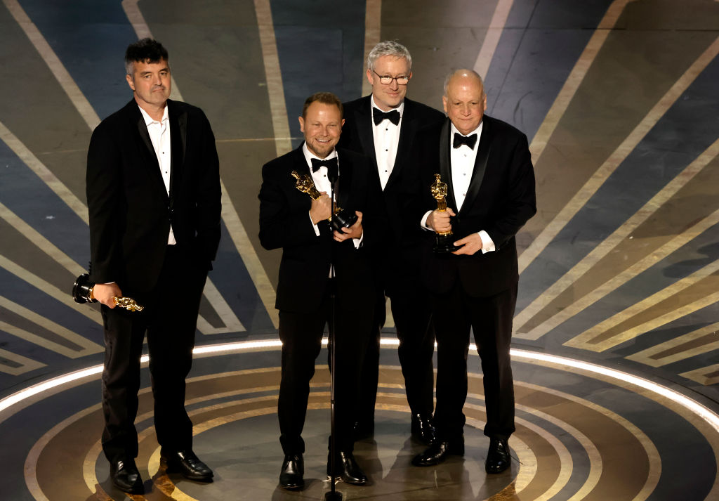 Eric Saindon, Richard Baneham, Daniel Barrett and Joe Letteri accept the Best Visual Effects award for 