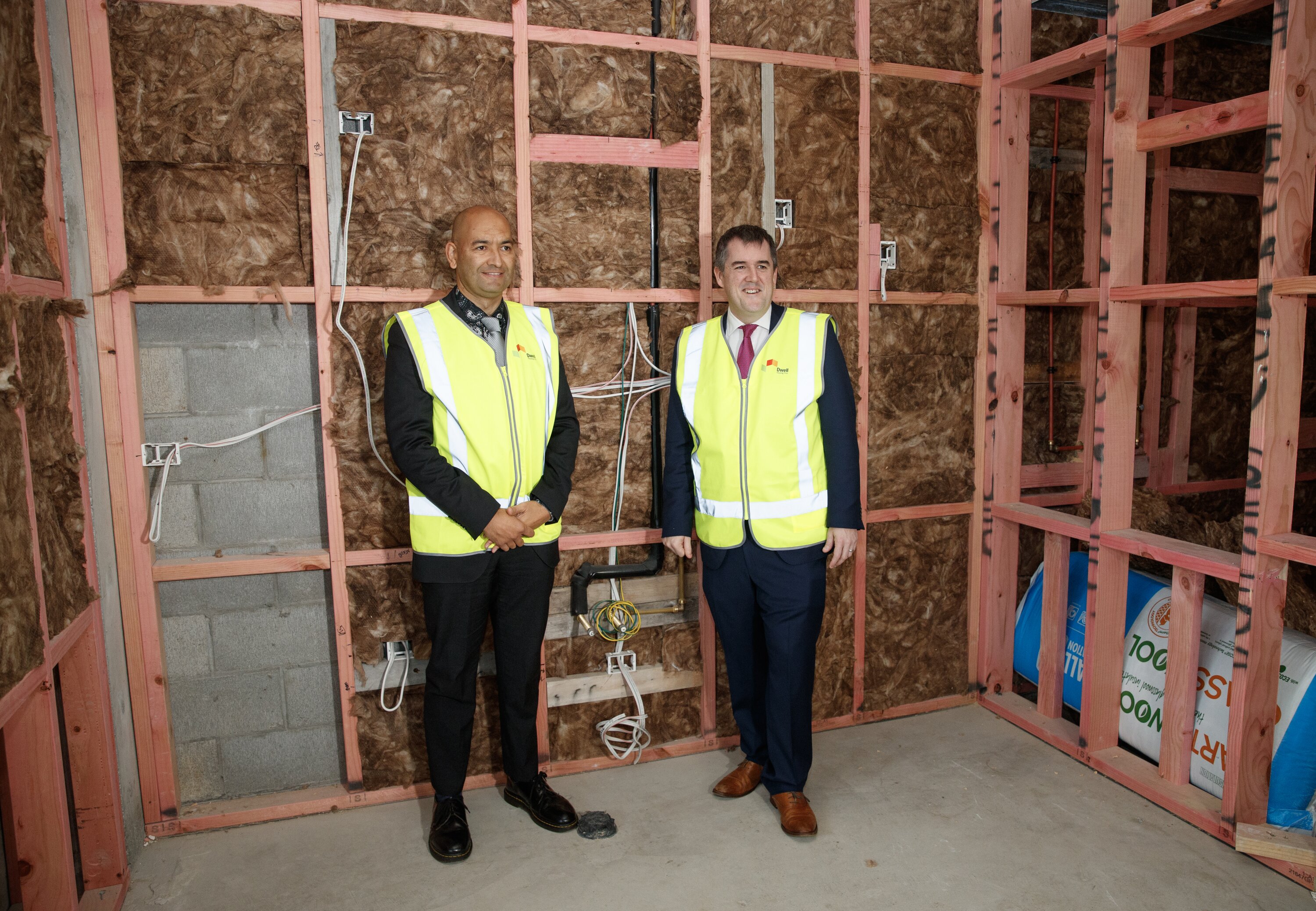 Housing Minister Chris Bishop (right) and Associate Housing Minister Tama Potaka during their visit to the Dwell Housing Trust community housing project in Kilbirnie, Wellington. Photo / Mark Mitchell  