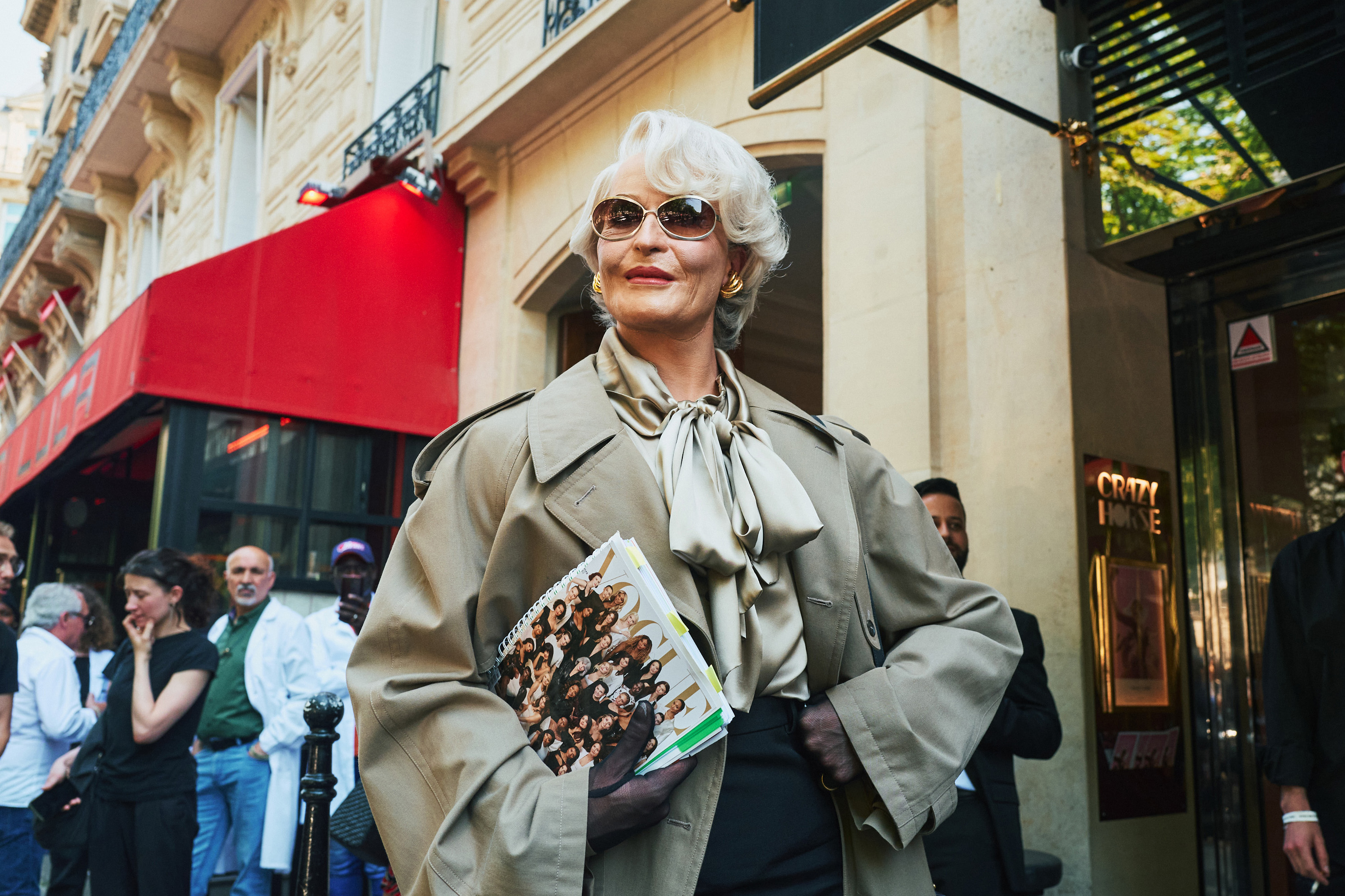 The “devil” herself: a person dressed as Miranda Priestly, the fictional fashion editor from the movie The Devil Wears Prada, replete with a mock issue of Vogue, outside the Balenciaga show during Couture Week in Paris. Photo / New York Times