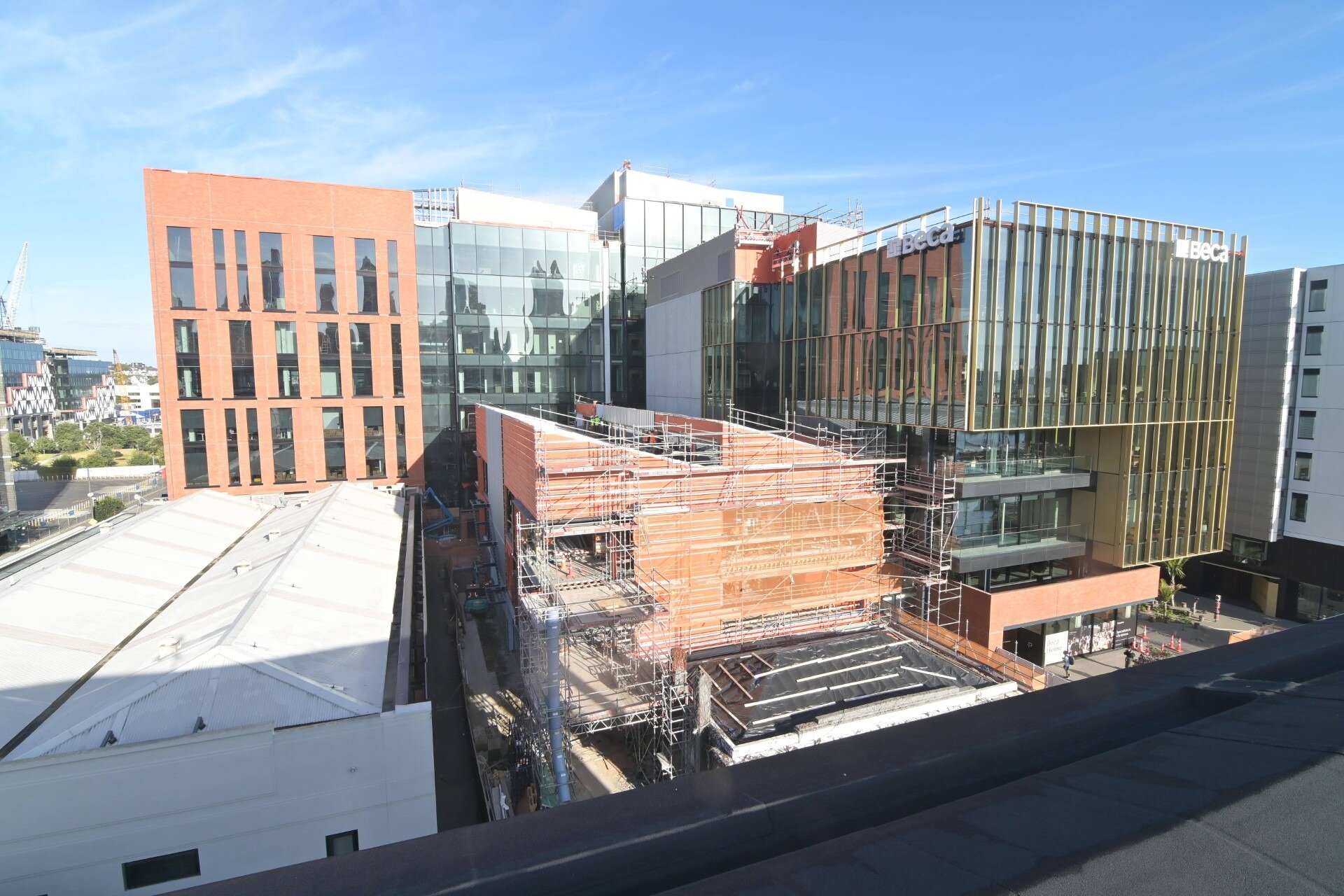  The new $300 million Beca House is an L-shaped structure: main building to the right with its name on it, as well as the new structures behind the Flowers Building (centre, covered in scaffolding). This is as at March 10, 2025. Photo / Precinct Properties