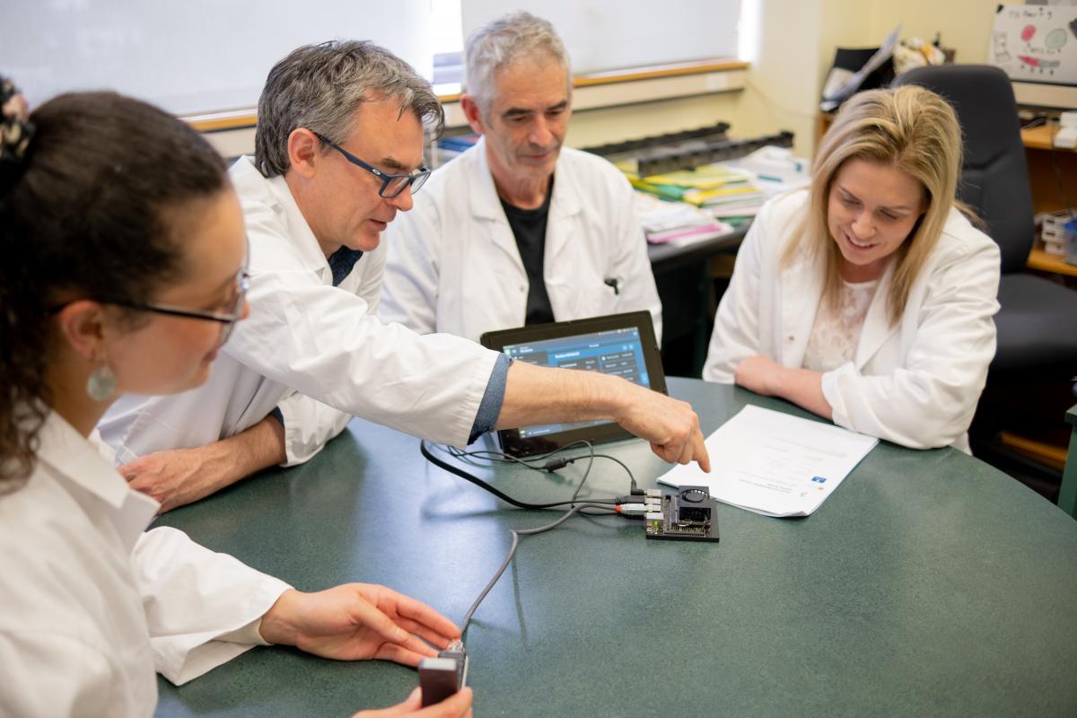 Researchers (from left) University of Otago PhD student Jordon Lima, Professor Mik Black and Professor Parry Guilford with Melissa Vining. Photo / Supplied via Otago Daily Times