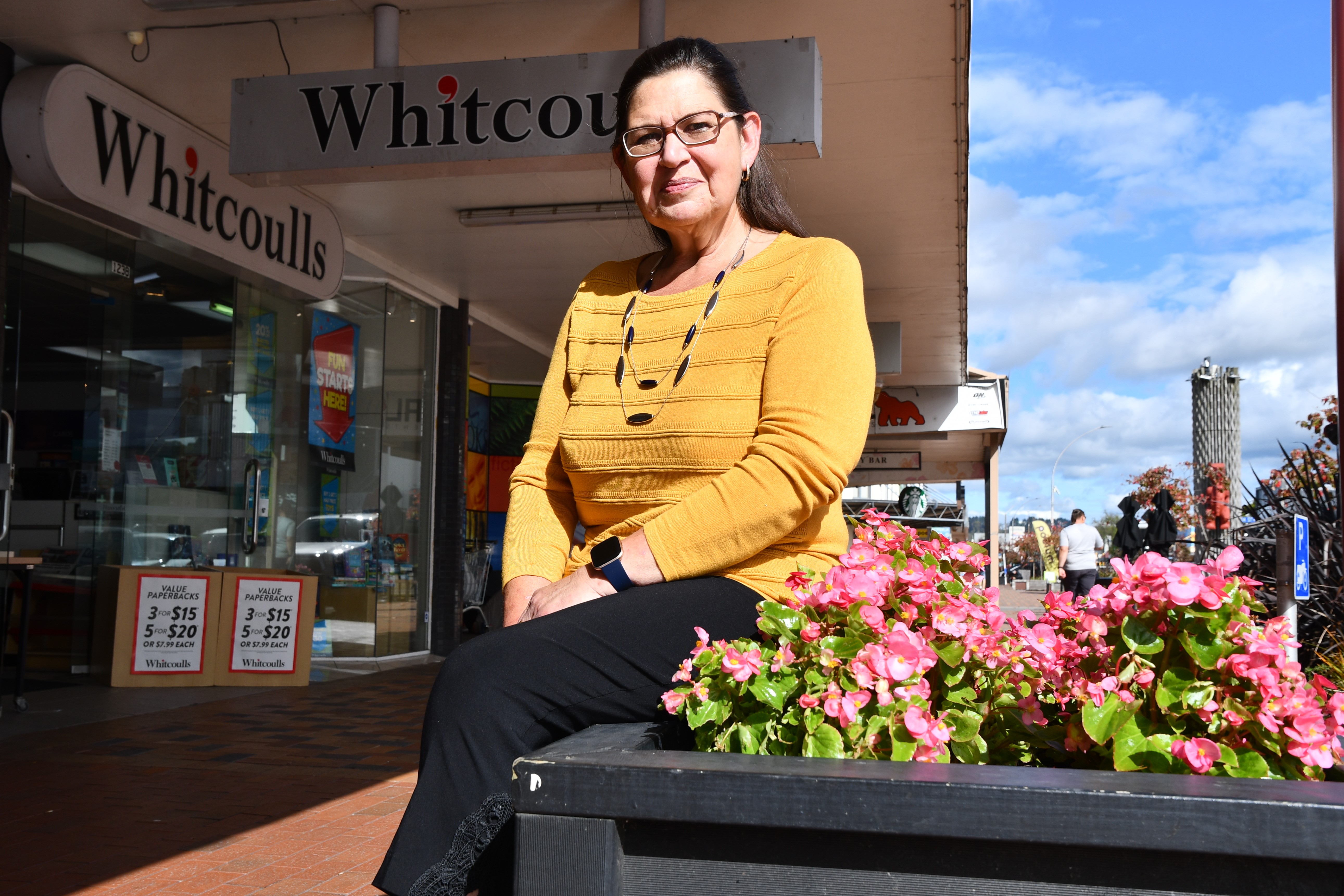 Millers Fashion store manager Janet Collins said it would be a shame to see Rotorua's inner-city flower beds removed. Photo / Laura Smith