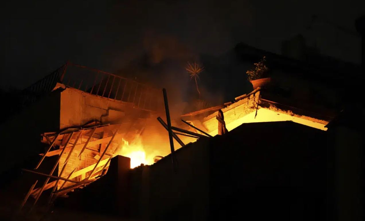 Fire burns at an apartment of an Islamic Jihad commander for northern Gaza, following Israeli airstrikes in Gaza City. Photo / AP
