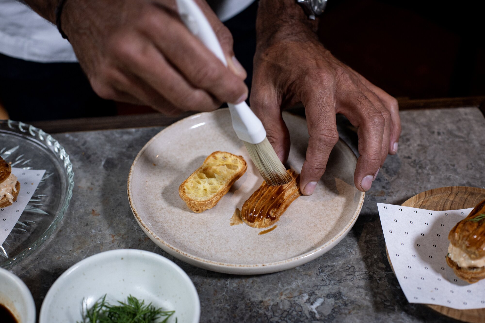 The all-important glaze that coats the top of Josh Emett's iconic crayfish eclair. Photo / Dean Purcell