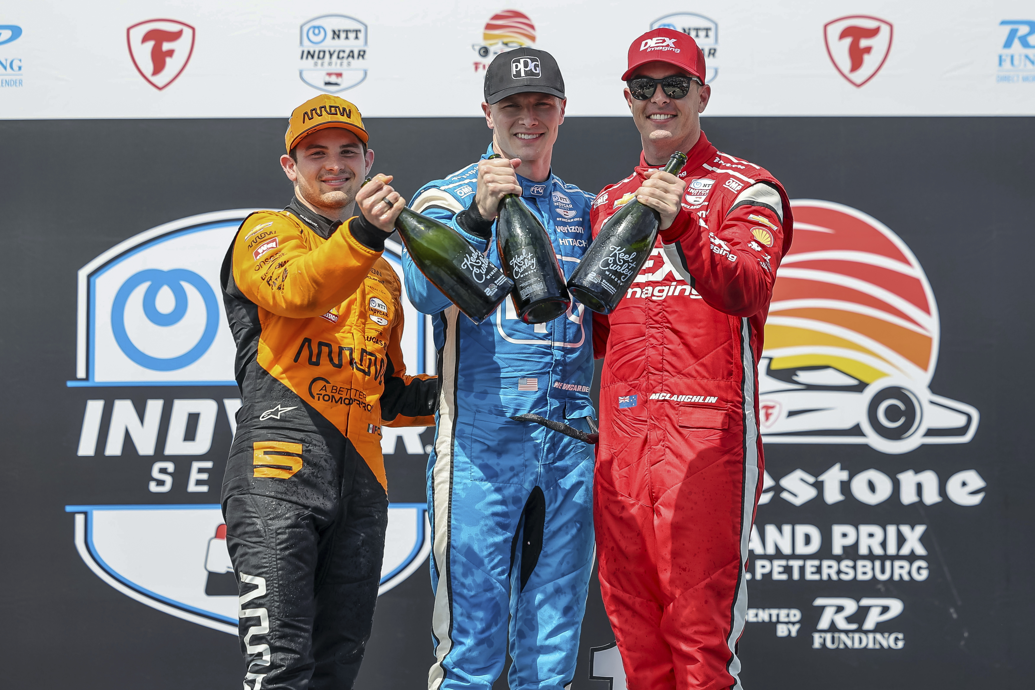 Josef Newgarden (centre) and Scott McLaughlin (right) have been stripped of their podium finishes from St Petersburg. Photo / AP