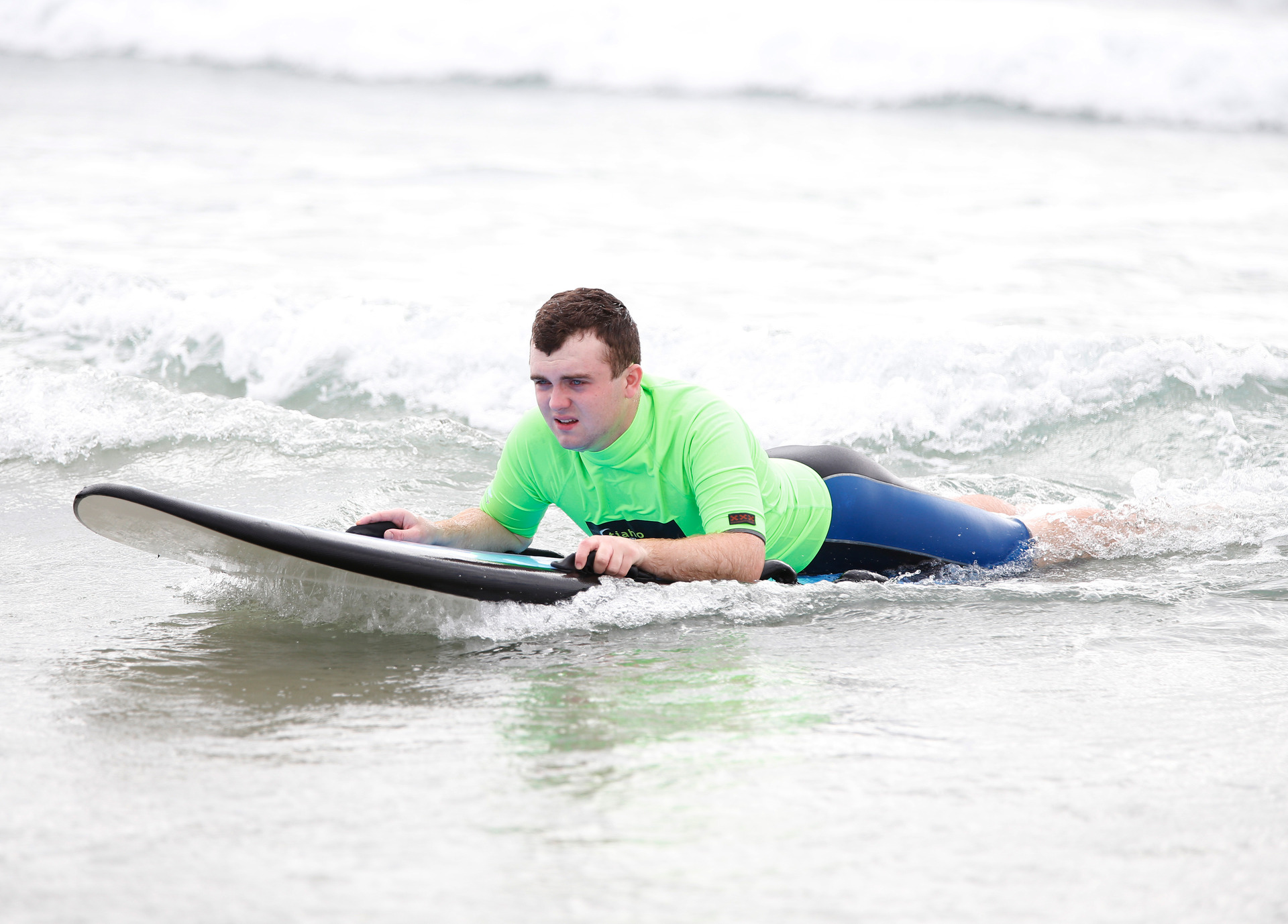 Sam Cove-Smith, 20, from Maungatapere heads to the shore on a wave. 