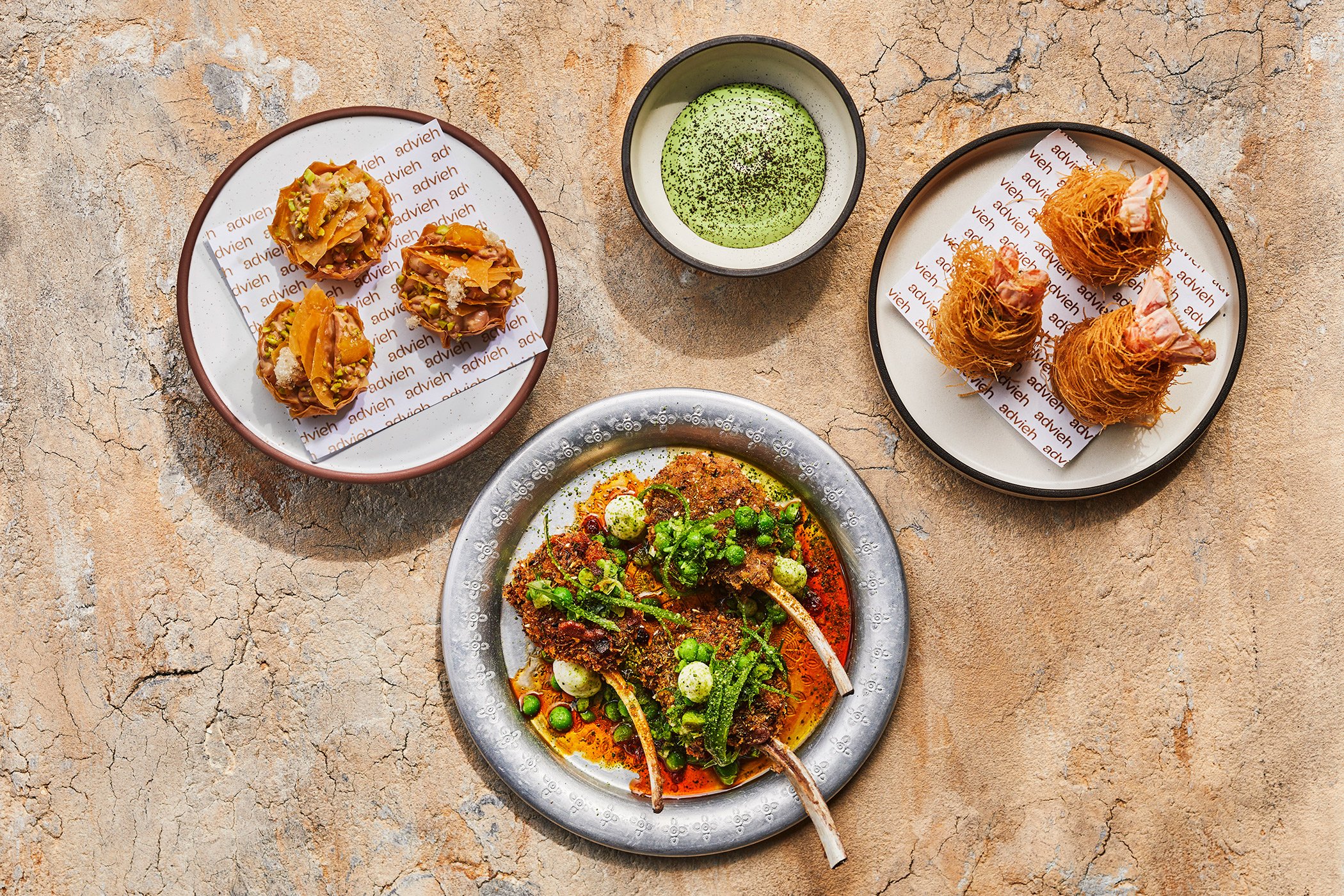 A selection of snacks from Advieh at the InterContinental Auckland - the chicken liver baklava (top left), crispy kataifi and coastal lamb chop. Photo / Supplied
