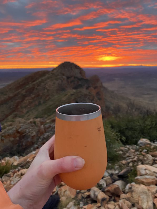 Hot coffee and a spectacular sunrise at the summit of Mount Sonder. Photo / Anna Sarjeant