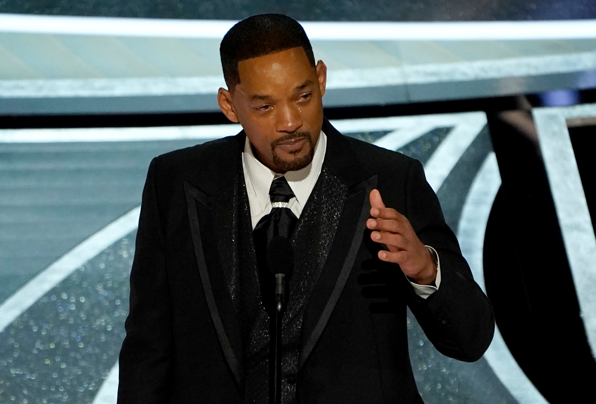 Will Smith cries as he accepts the award for best performance by an actor in a leading role for 