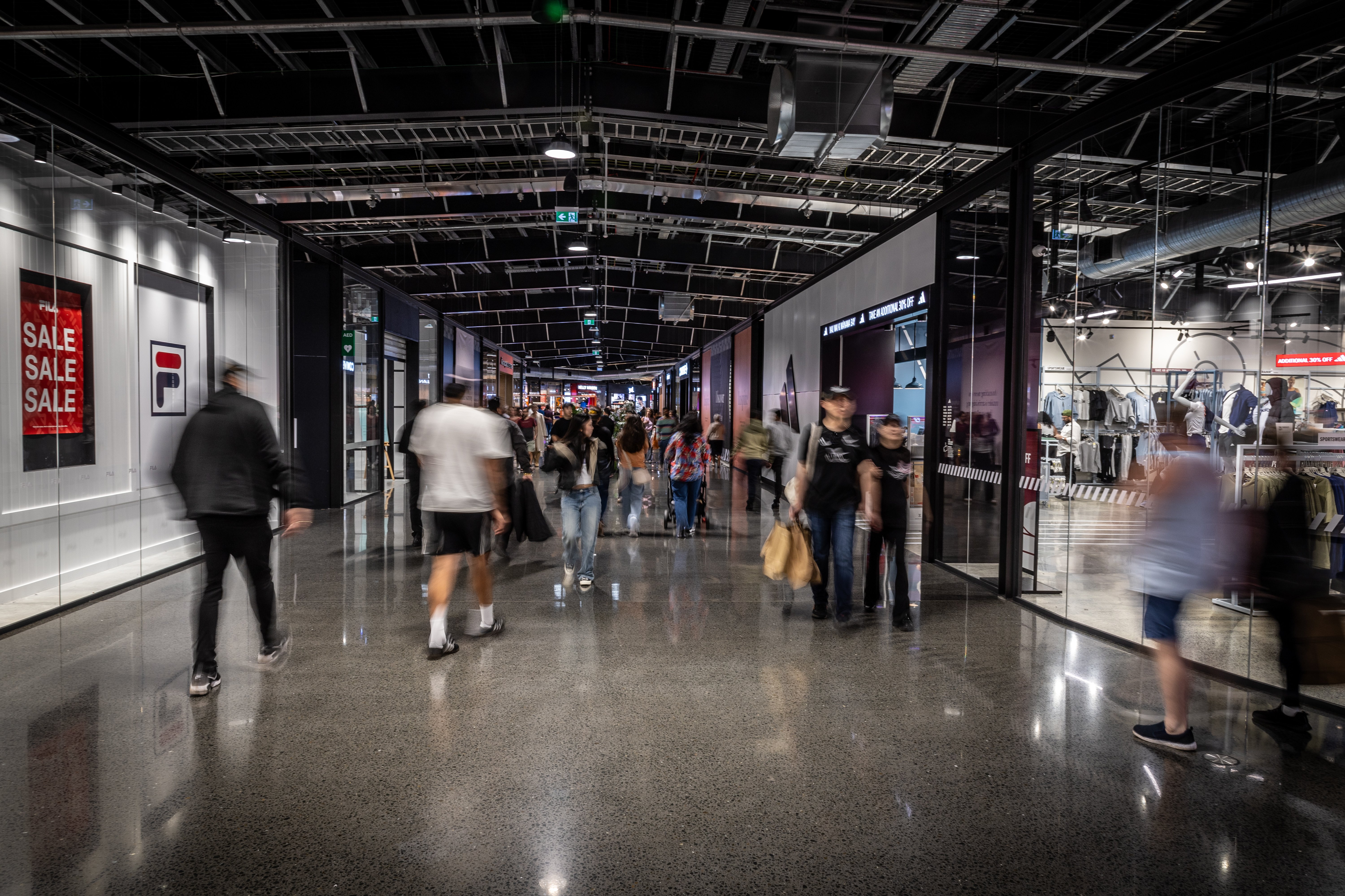 Wide 7.5m aisles at Mānawa Bay shopping centre, with walkways taking shoppers in a giant circle across the many hectares of floorspace. Photo / Michael Craig