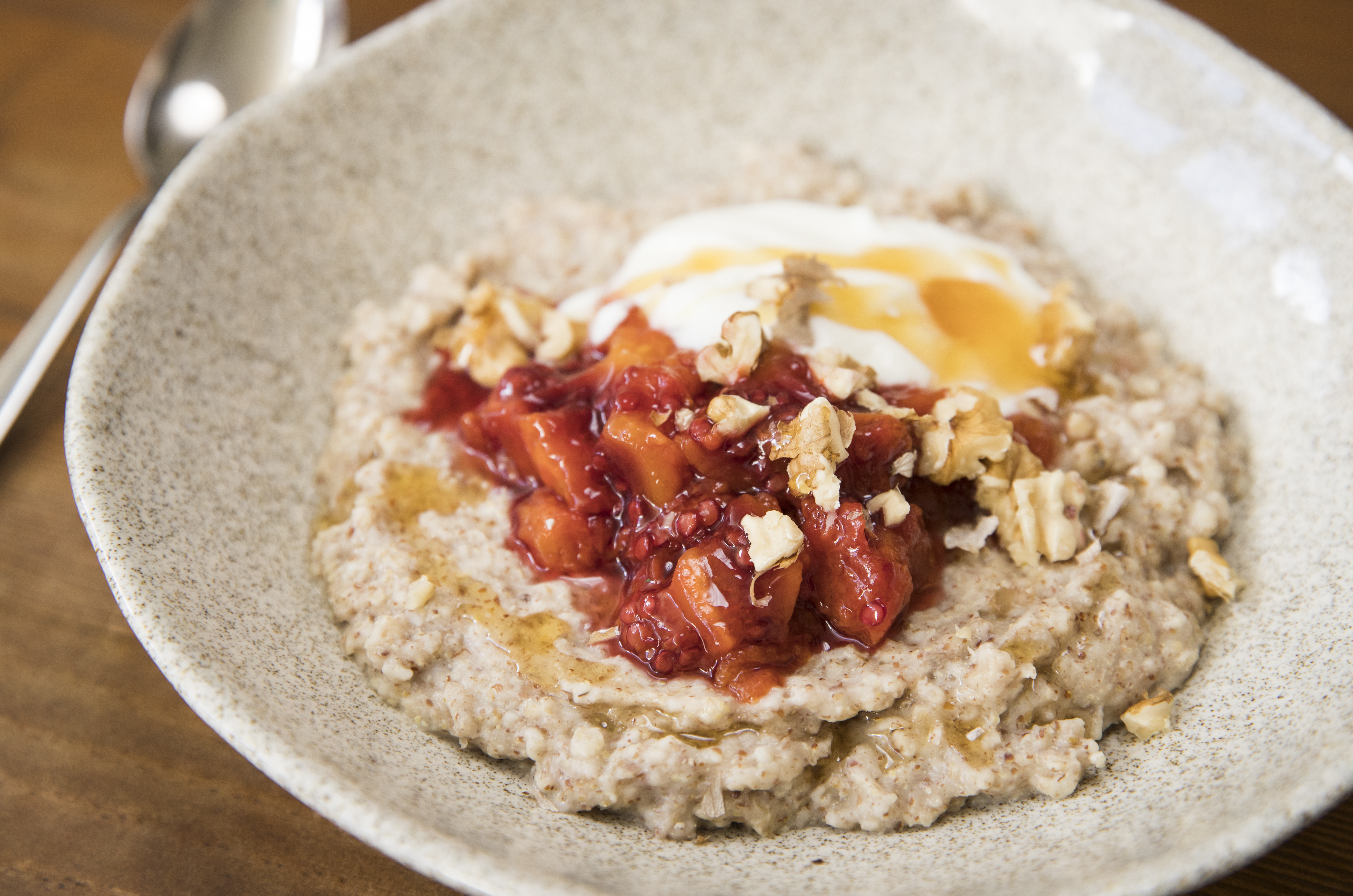 Adding some seasonal fruit, like these poached tamarillos, takes porridge up a notch. Photo / Greg Bowker
