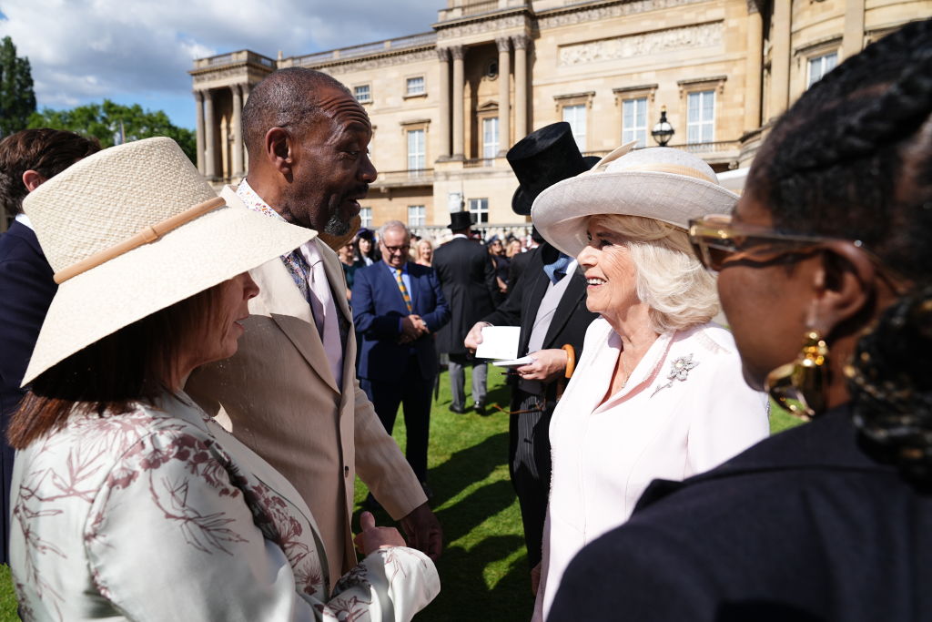 Queen Camilla speaks with Sir Lenny Henry during the garden party at Buckingham Palace. Photo / Getty Images