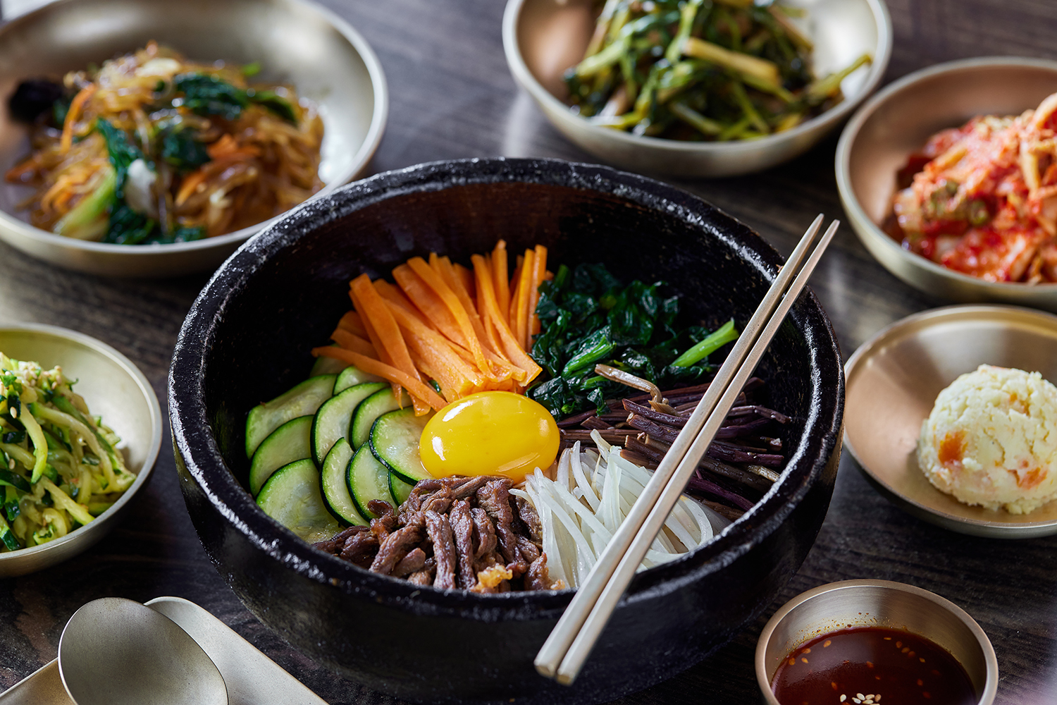 The bibimbap plus a range of flavoursome additions like pickled vegetables and chilli sauce. Photo / Babiche Martens