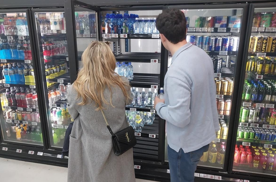 Shoppers look for bottled water in Queenstown amid the outbreak. Photo / Matt Porter
