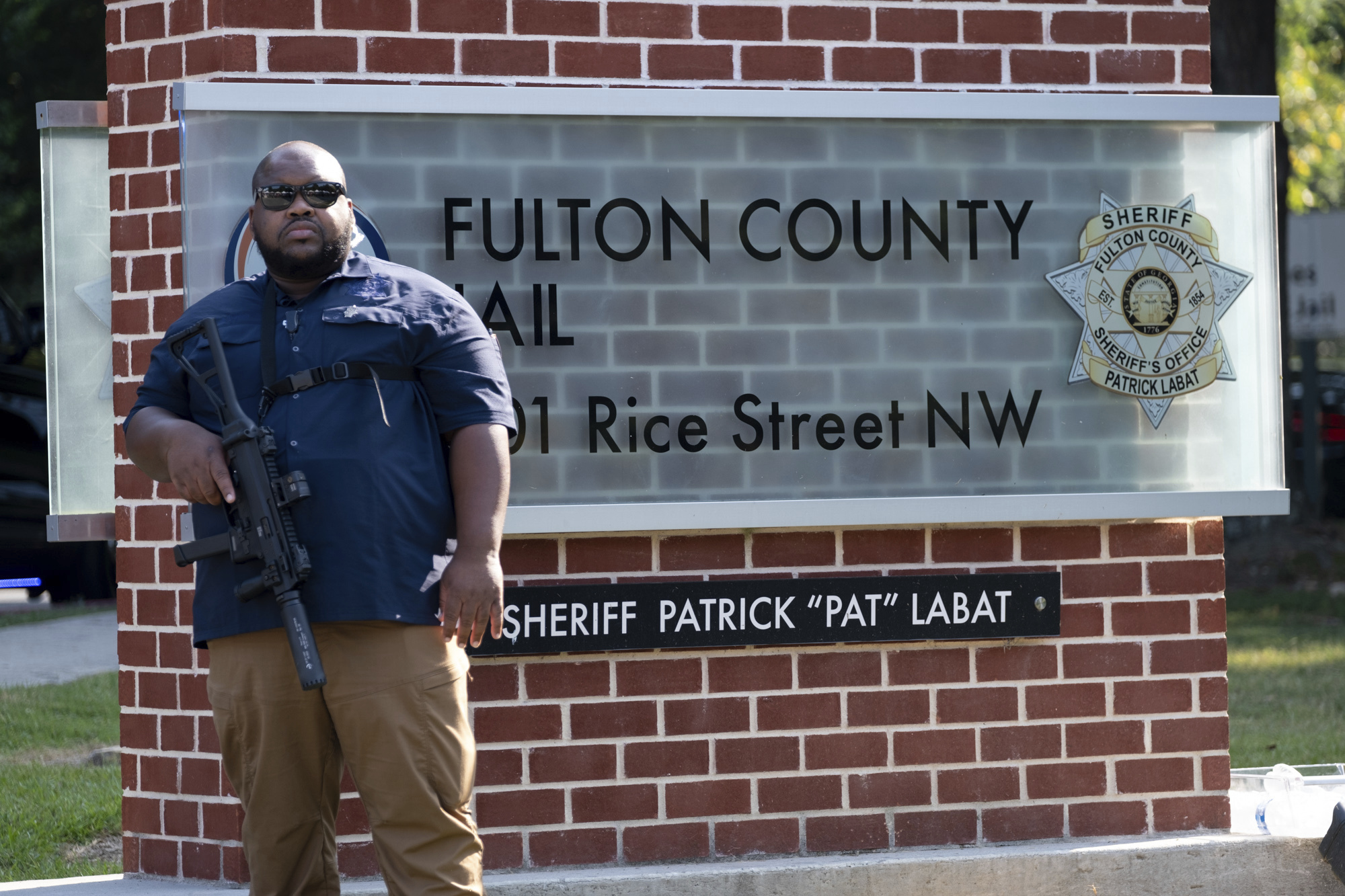 An official stands guard in front of the Fulton County Jail in Atlanta. Photo / Ben Gray, AP