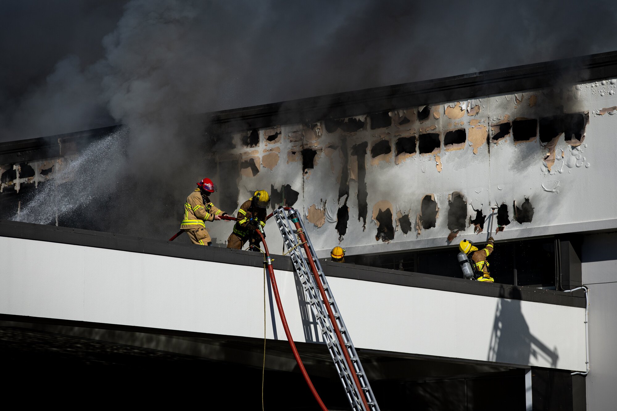 The extent of the damage to the New World supermarket in Victoria Park is clear as firefighters battle the blaze. Photo / Dean Purcell