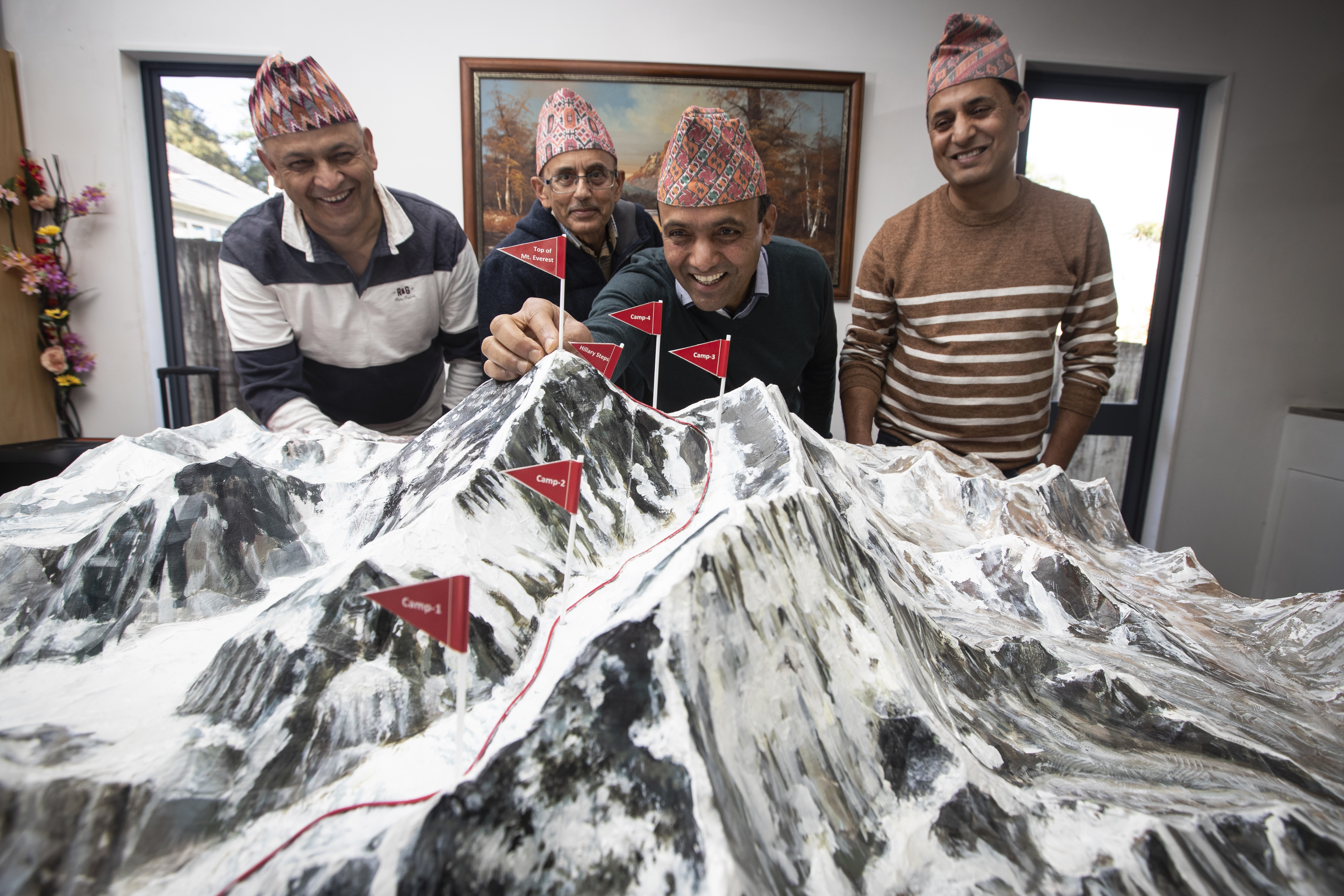 Nepalese community leaders with a 3D model of showing Hillary's route to the top of Mount Everest. From left, Dinesh Khadka, Uddhav Adhikary, Santosh Bhandari and Suman Dhungal. Photo / Jason Oxenham