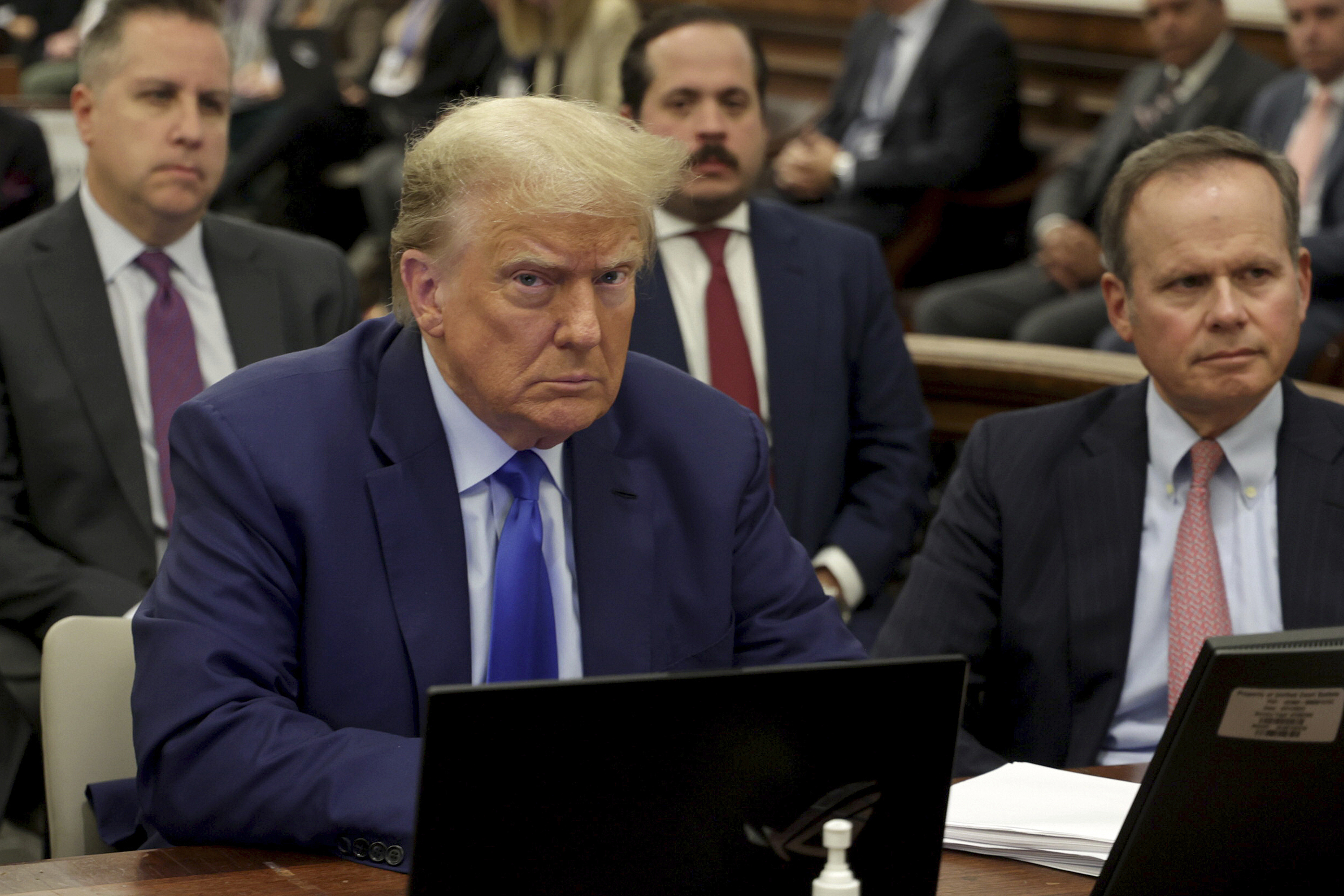 Former President Donald Trump, left, and his attorney Chris Kise attend his civil business fraud trial at the New York Supreme Court on October 24. (Luiz C. Ribeiro/ via AP)