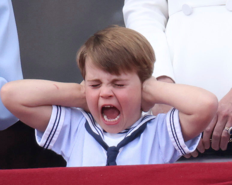 Prince Louis reacts during the flypast on the balcony of Buckingham Palace in London. Photo / AP